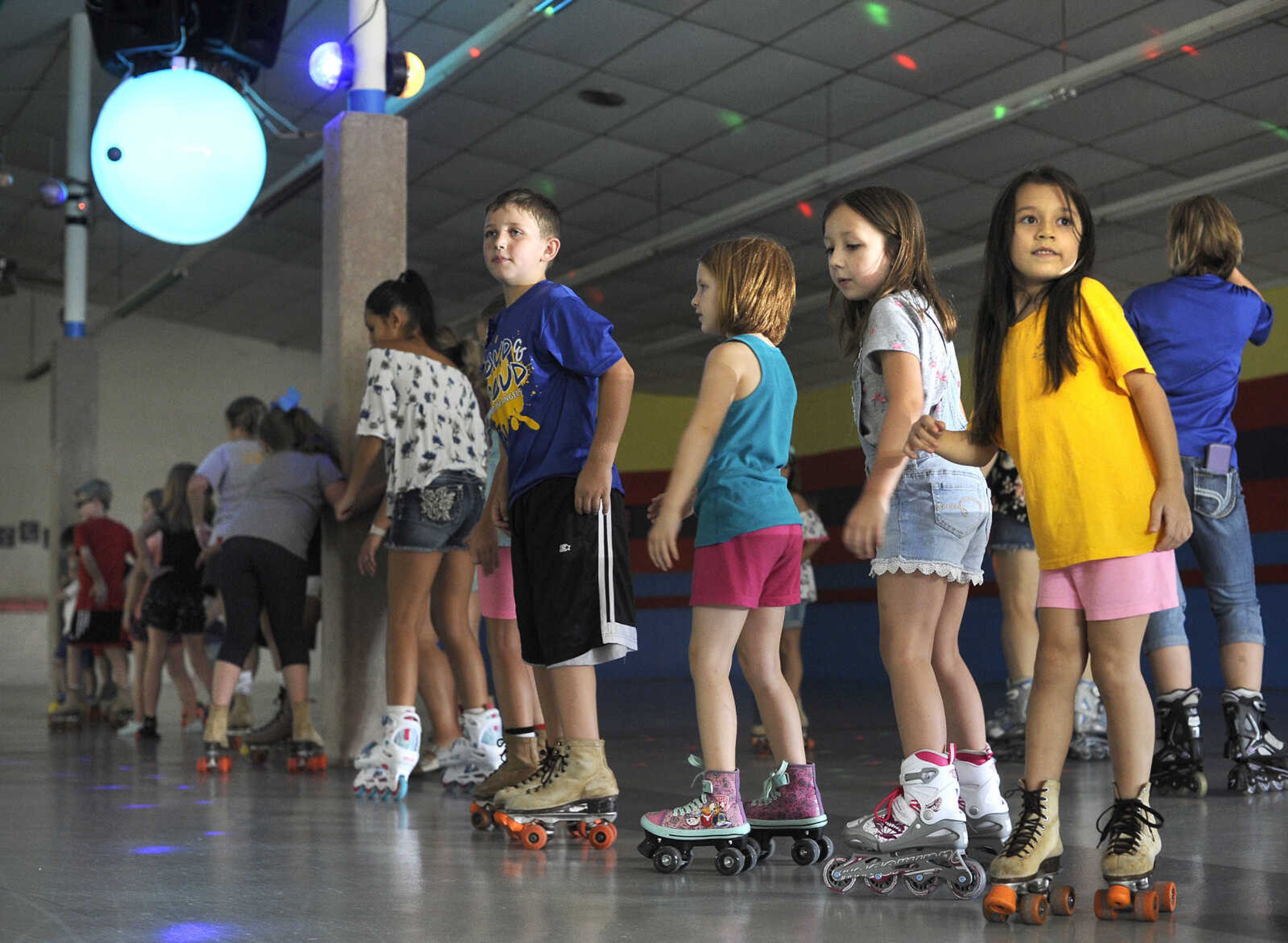 FRED LYNCH ~ flynch@semissourian.com
Students of St. Ambrose School do the "Hokey Pokey" during a "back-to-school bash" Sunday, Aug. 12, 2018 at Willow Grove Roller Rink in Chaffee, Missouri.