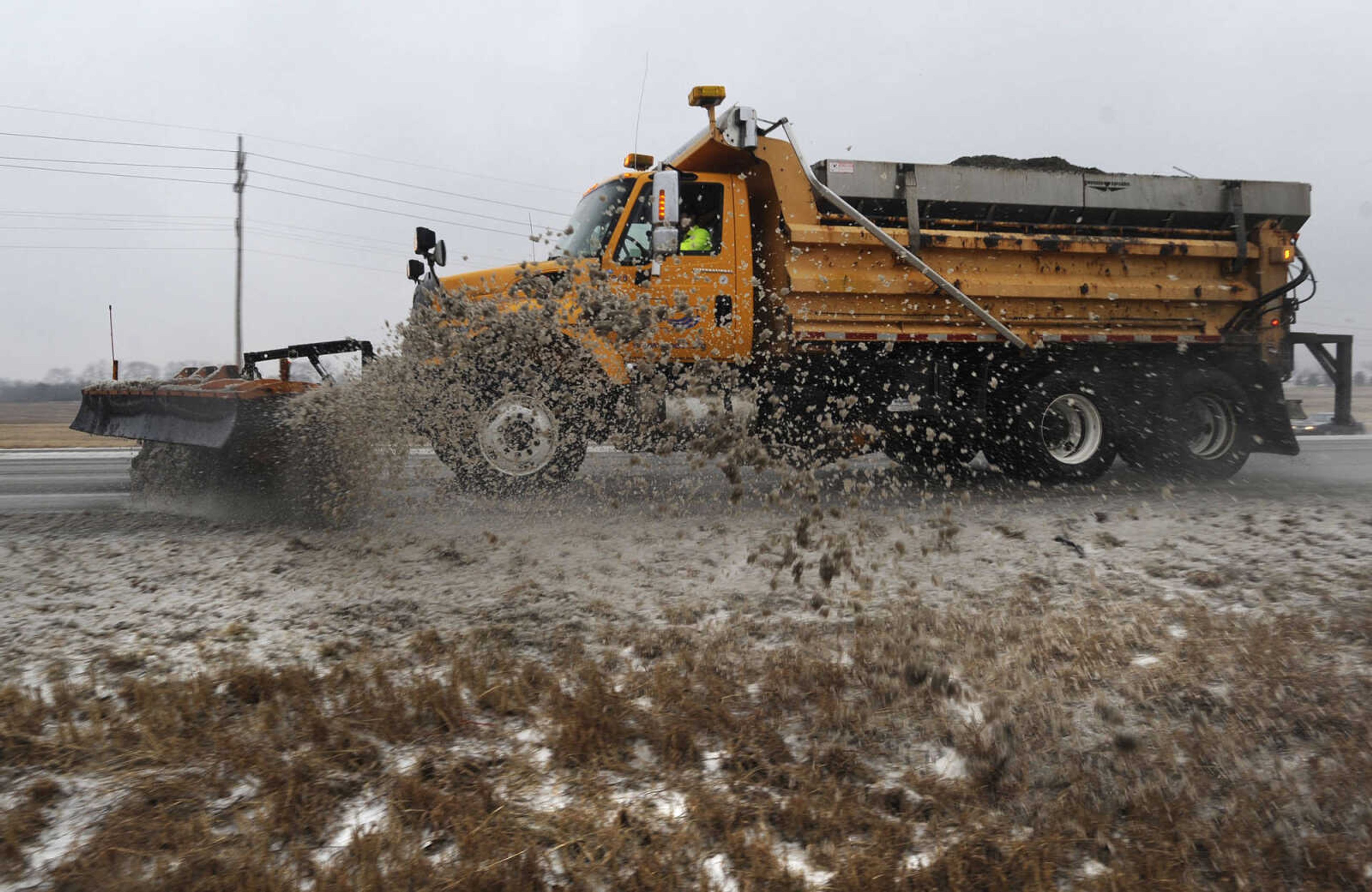 FRED LYNCH ~ flynch@semissourian.com
A Missouri Department of Transportation snow plow clears a lane of northbound Interstate 55 near Center Junction on Tuesday, Feb. 4, 2014 north of Cape Girardeau.