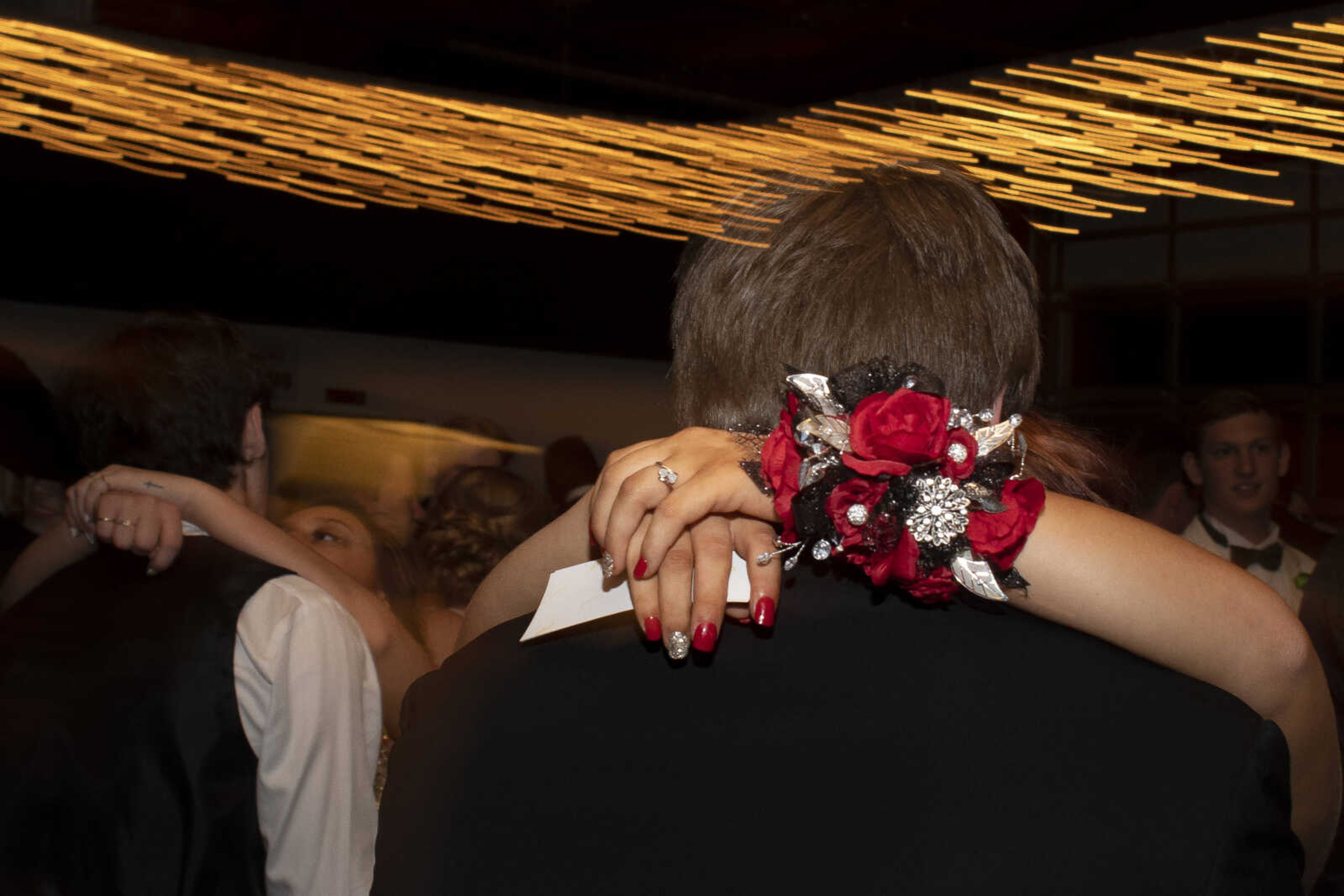 Scott City sophomore Taylor Kluesner places her arms around the neck of Scott City junior Noah Braun during Scott City's prom Saturday, April 6, 2019, at Deerfield Lodge in Cape Girardeau.&nbsp;