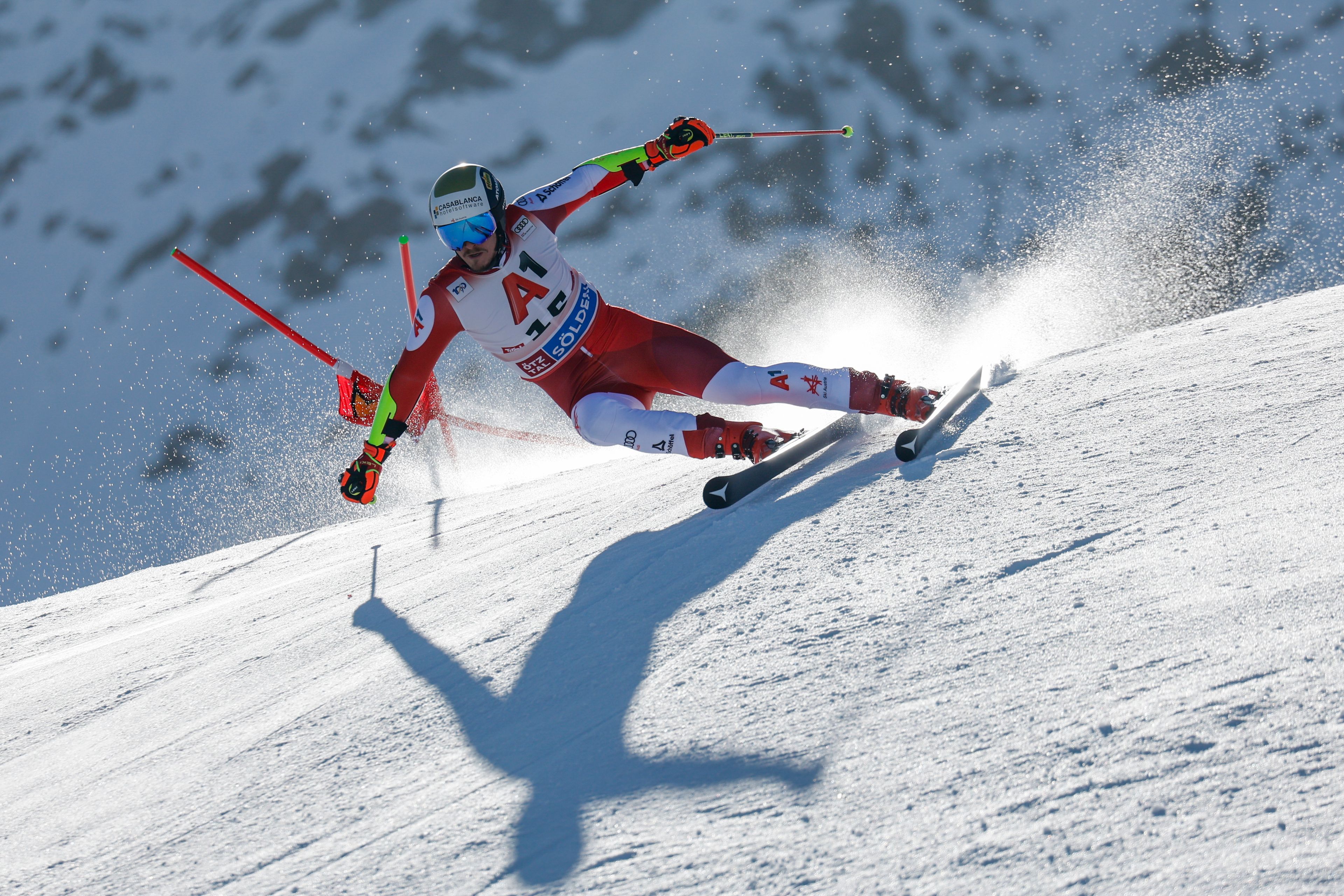 Austria's Manuel Feller speeds down the course during an alpine ski, men's World Cup giant slalom, in Soelden, Austria, Sunday, Oct. 27, 2024. (AP Photo/Alessandro Trovati)