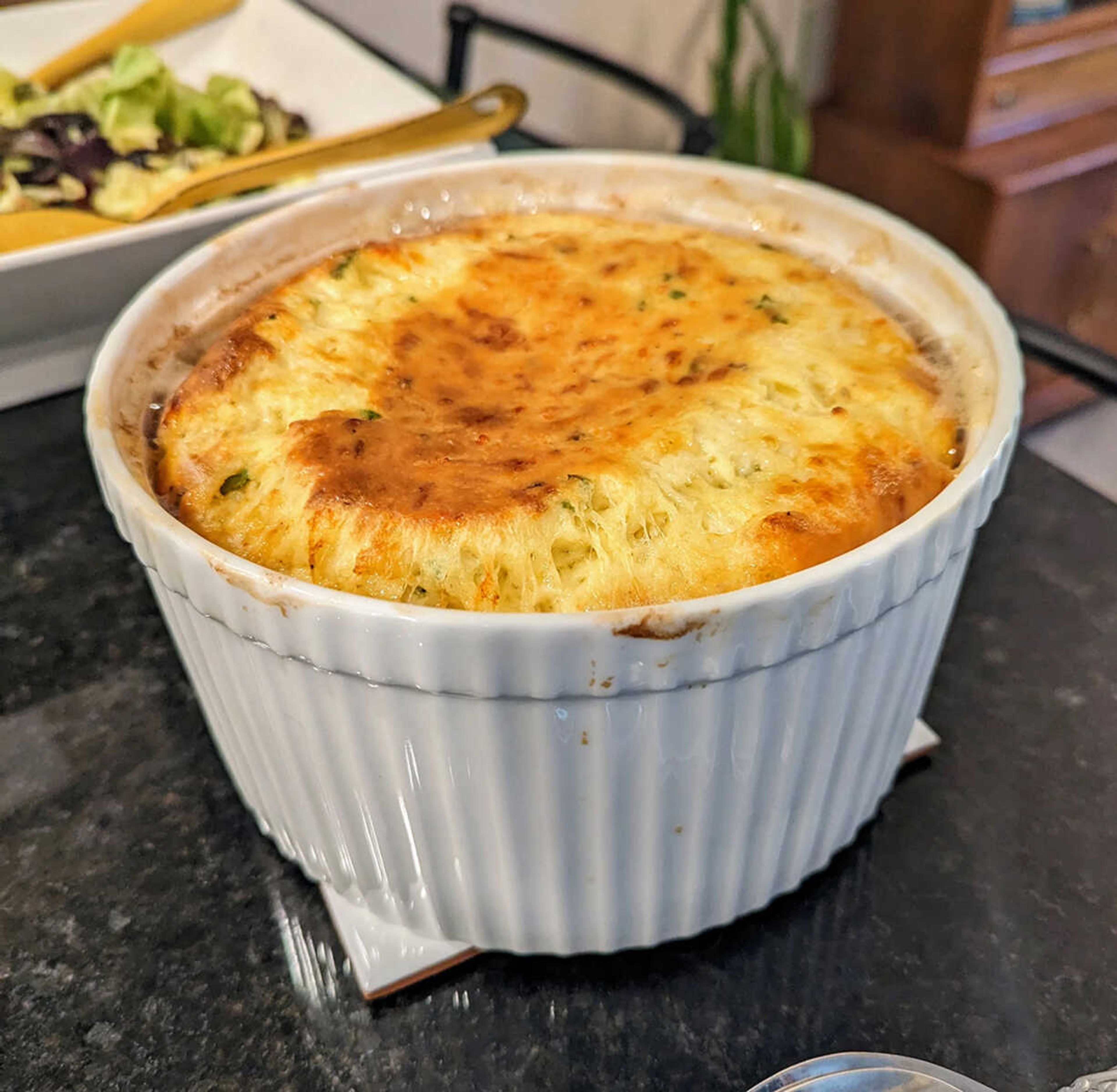 The inadvertent genius of this souffle is that it does not require separating eggs, let alone beating the whites, yet it still works.