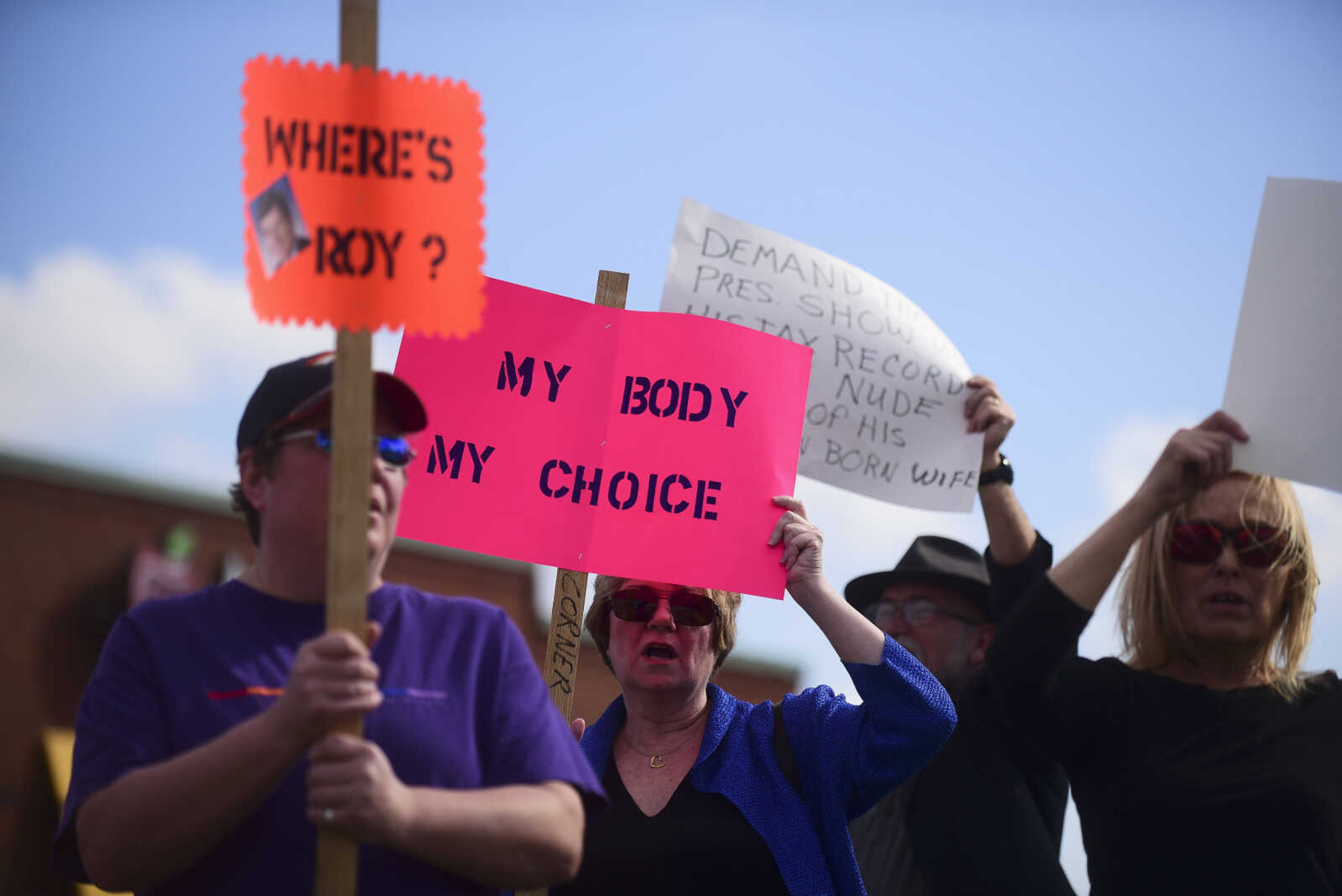 About 50 people with the Liberal Women Unite-Southeast MO Chapter demonstrate in front of U.S. Sen. Roy Blunt's office Wednesday, Feb. 22, 2017 in Cape Girardeau. Protestors held signs and chanted "Where's Roy" to demand a Town Hall Meeting with Senator Roy Blunt. As they spoke with the District Director, Darren Lingle, they brought up concerns they had along with saying they were not paid to be there with some having to even take vacation time to state what they believe in.