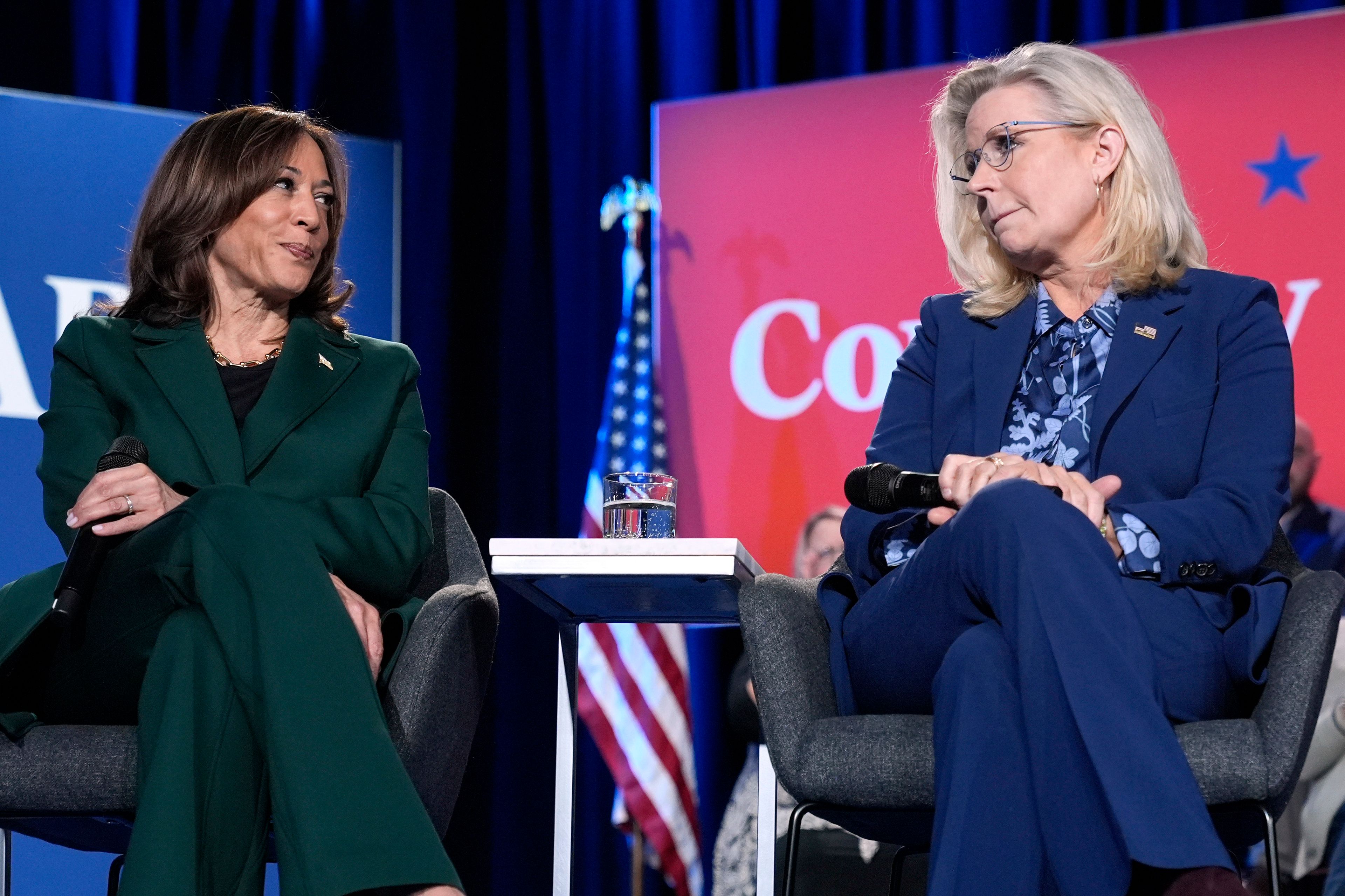 Democratic presidential nominee Vice President Kamala Harris, left, and former Republican Congresswoman Liz Cheney participate in a town hall at the Royal Oak Theatre in Royal Oak, Mich., Monday, Oct. 21, 2024. (AP Photo/Jacquelyn Martin)