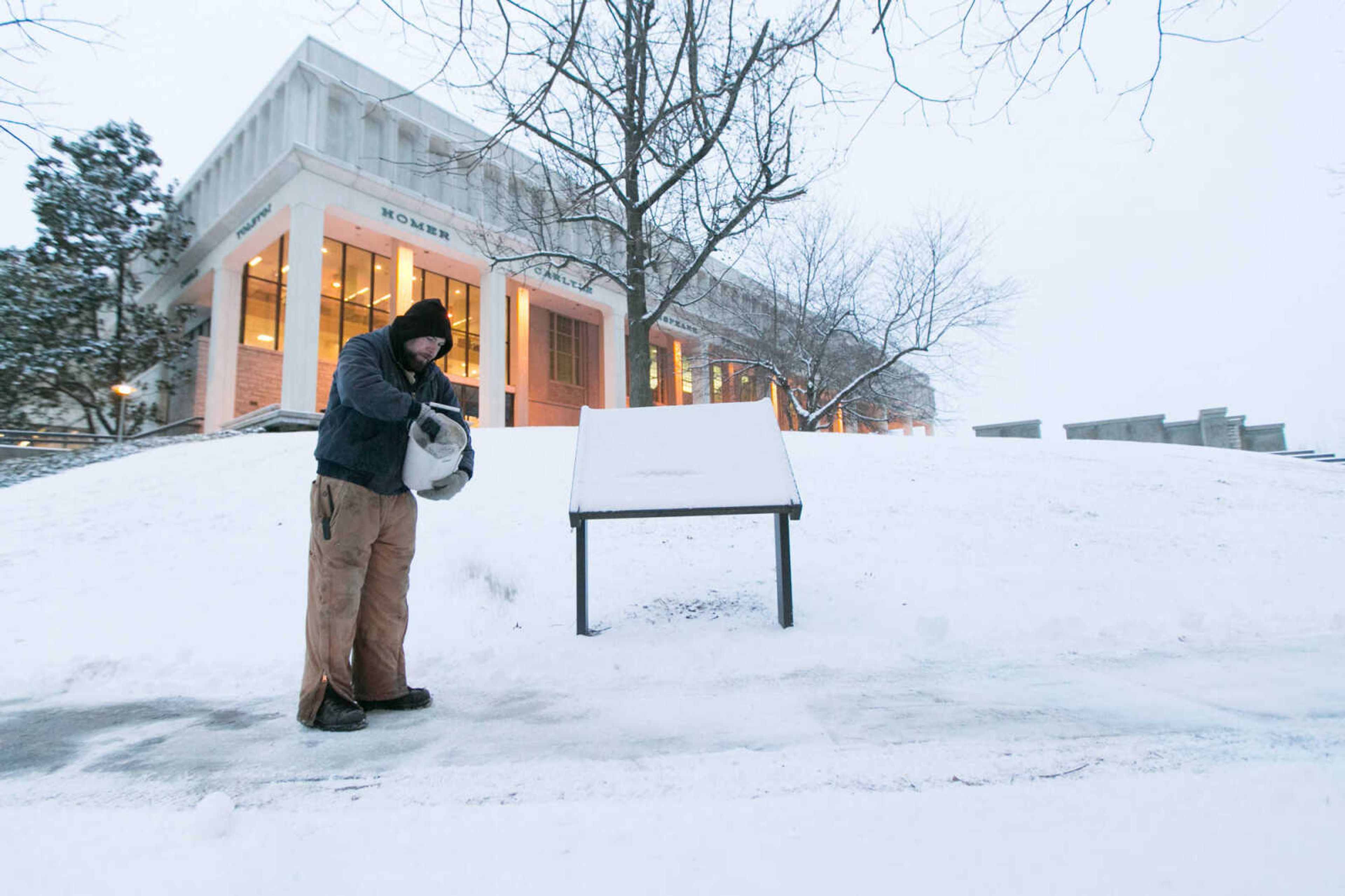 GLENN LANDBERG ~ glandberg@semissourian.com


Robert Pickens with Southeast Missouri State University's Facilities Management dispenses salt along a sidewalk in front of Kent Library Wednesday, Jan. 20, 2016.