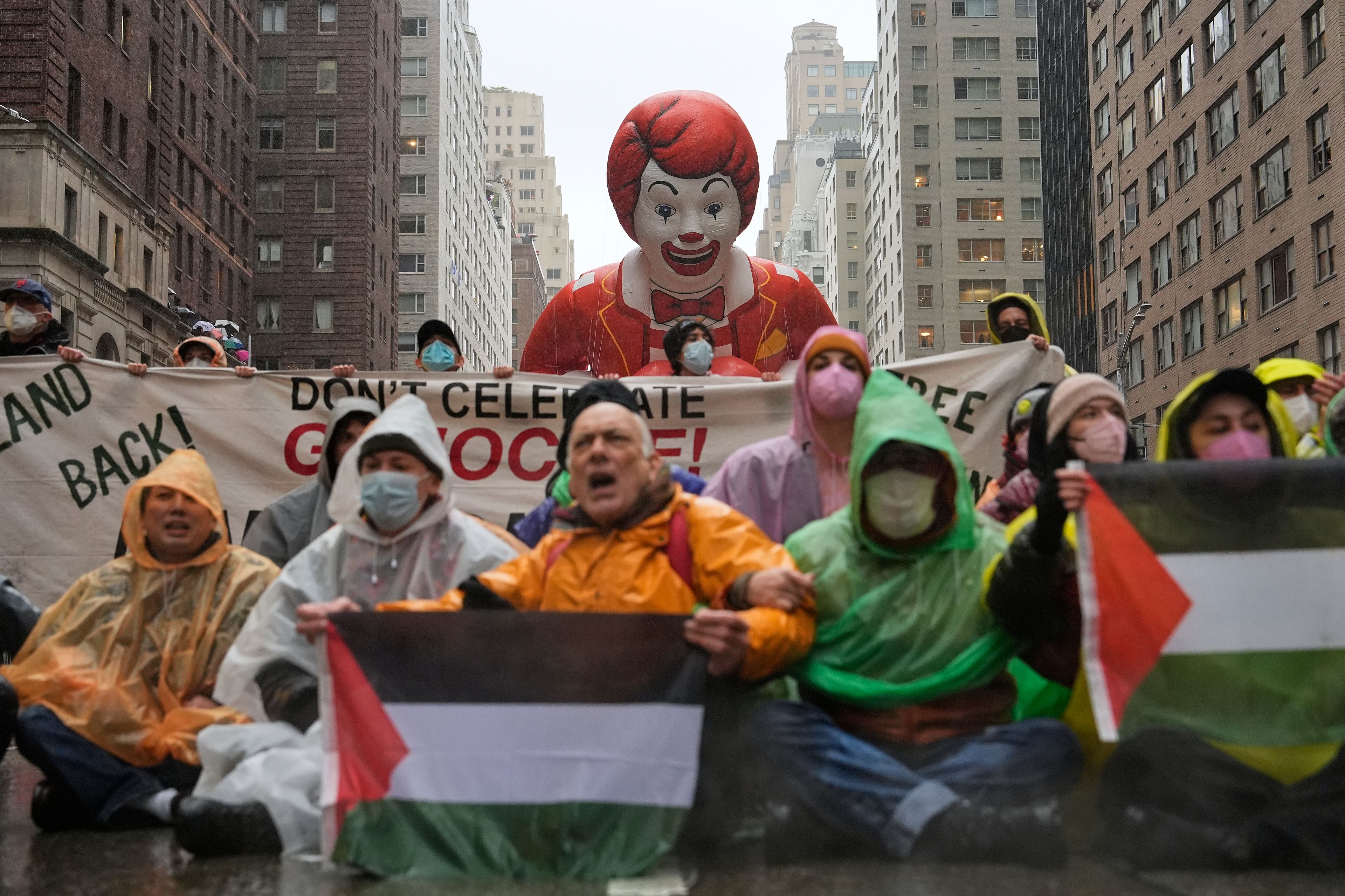 Pro-Palestinian protesters demonstrate on Sixth Avenue during the Macy's Thanksgiving Day Parade, Thursday, Nov. 28, 2024, in New York. (AP Photo/Julia Demaree Nikhinson)