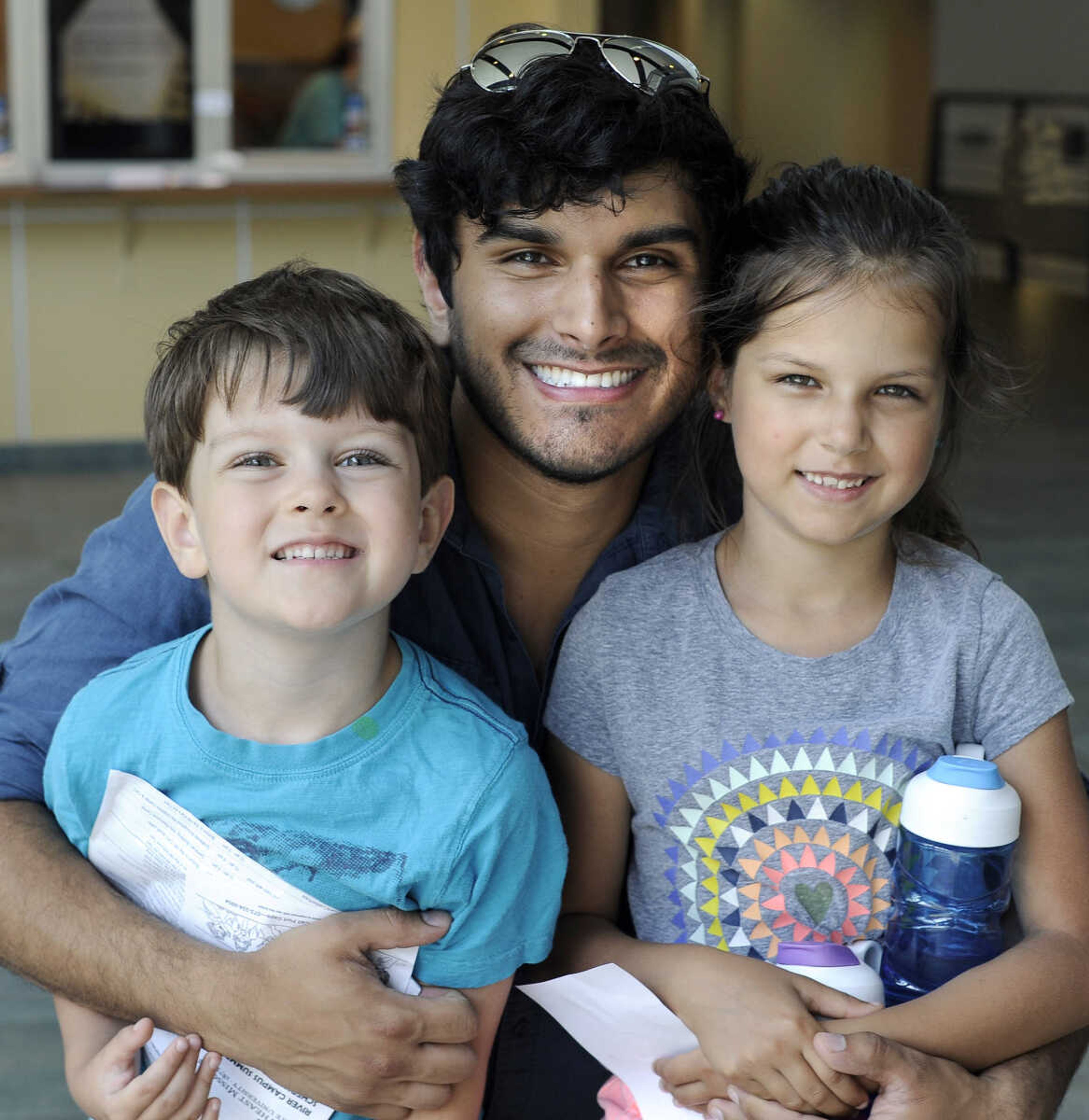 FRED LYNCH ~ flynch@semissourian.com
Michael Toeniskoetter and his children, Avery and Alice, pose for a photo Saturday, June 16, 2018 at the Summer Arts Festival at the River Campus.