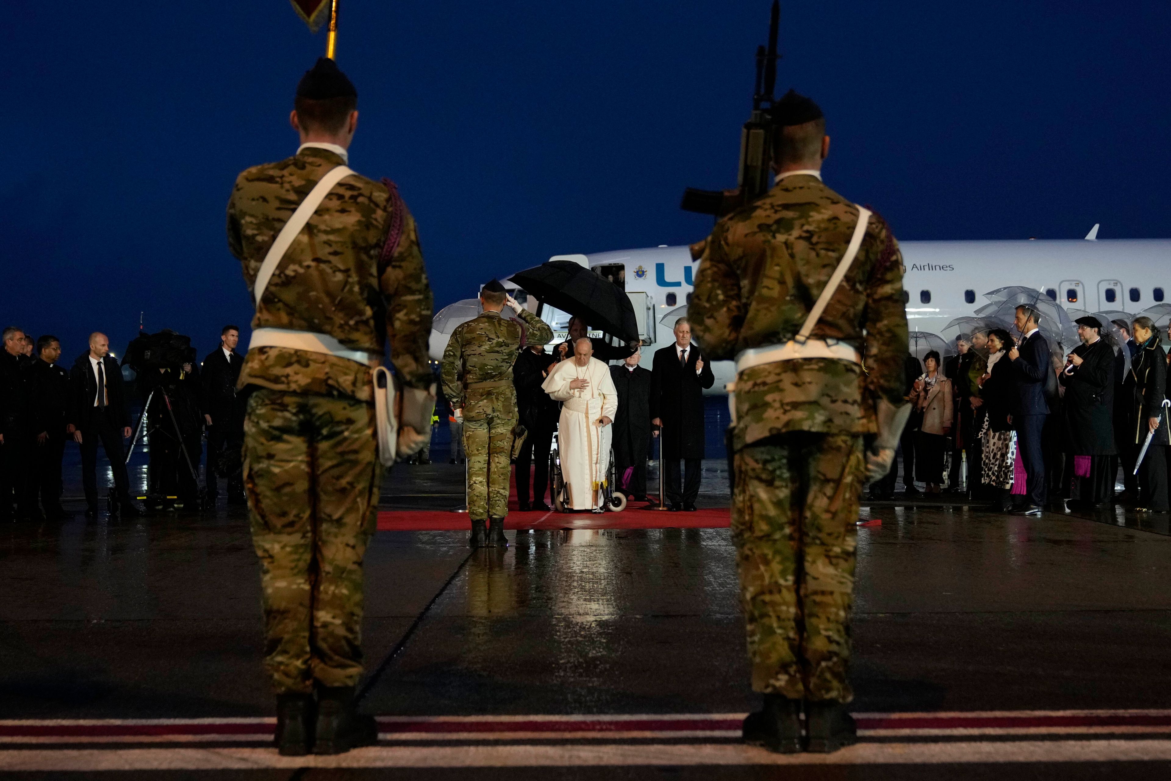 Pope Francis arrives at Melsbroek air base in Steenokkerzeel, near Brussels, on the first day of his four-day visit to Luxembourg and Belgium, Thursday, Sept. 26, 2024. (AP Photo/Andrew Medichini)