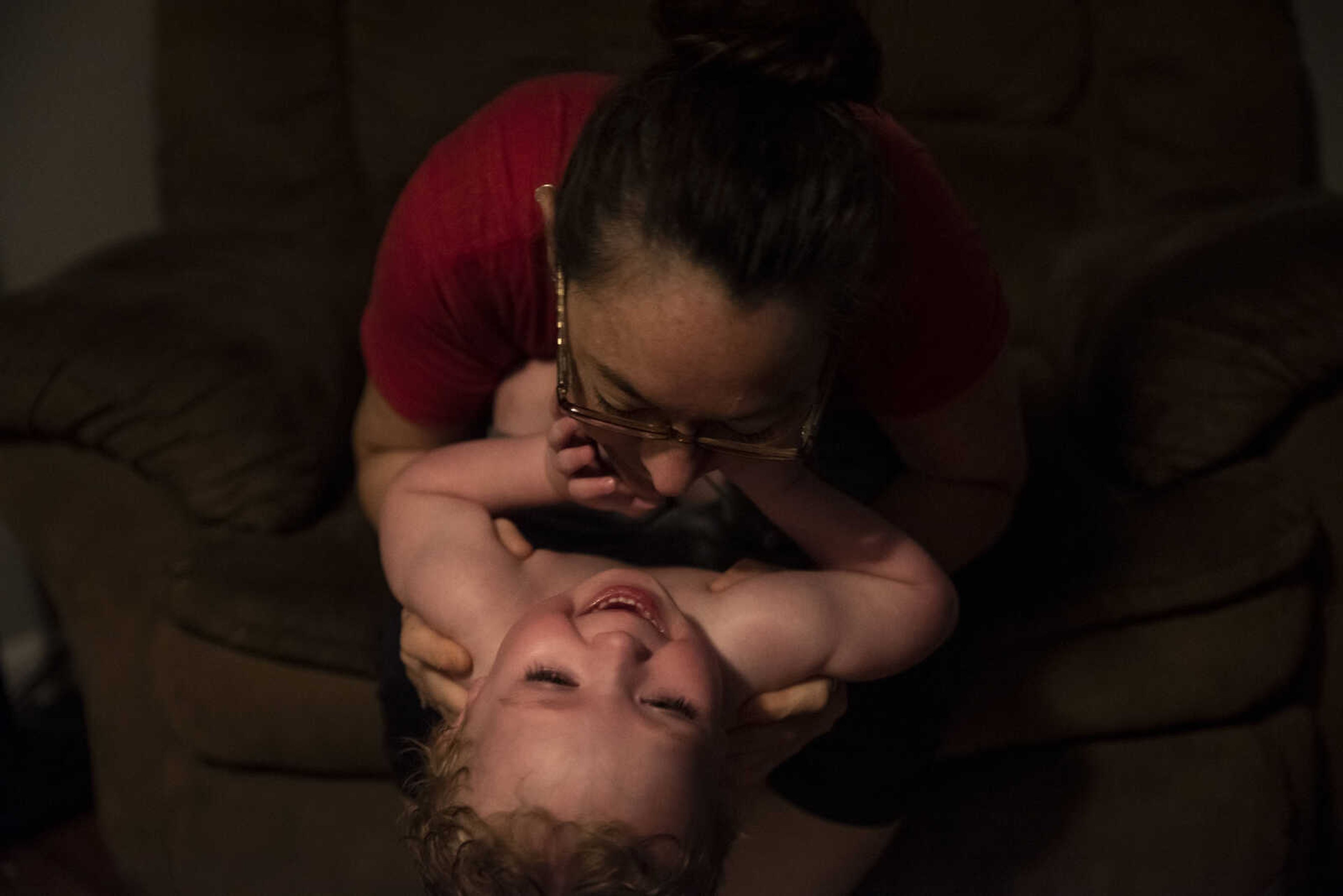 Phoenix Young, 2, laughs as he receives goodnight kisses from his "Mimi" Missy Medlock at home Tuesday, May 7, 2019, in Cape Girardeau.