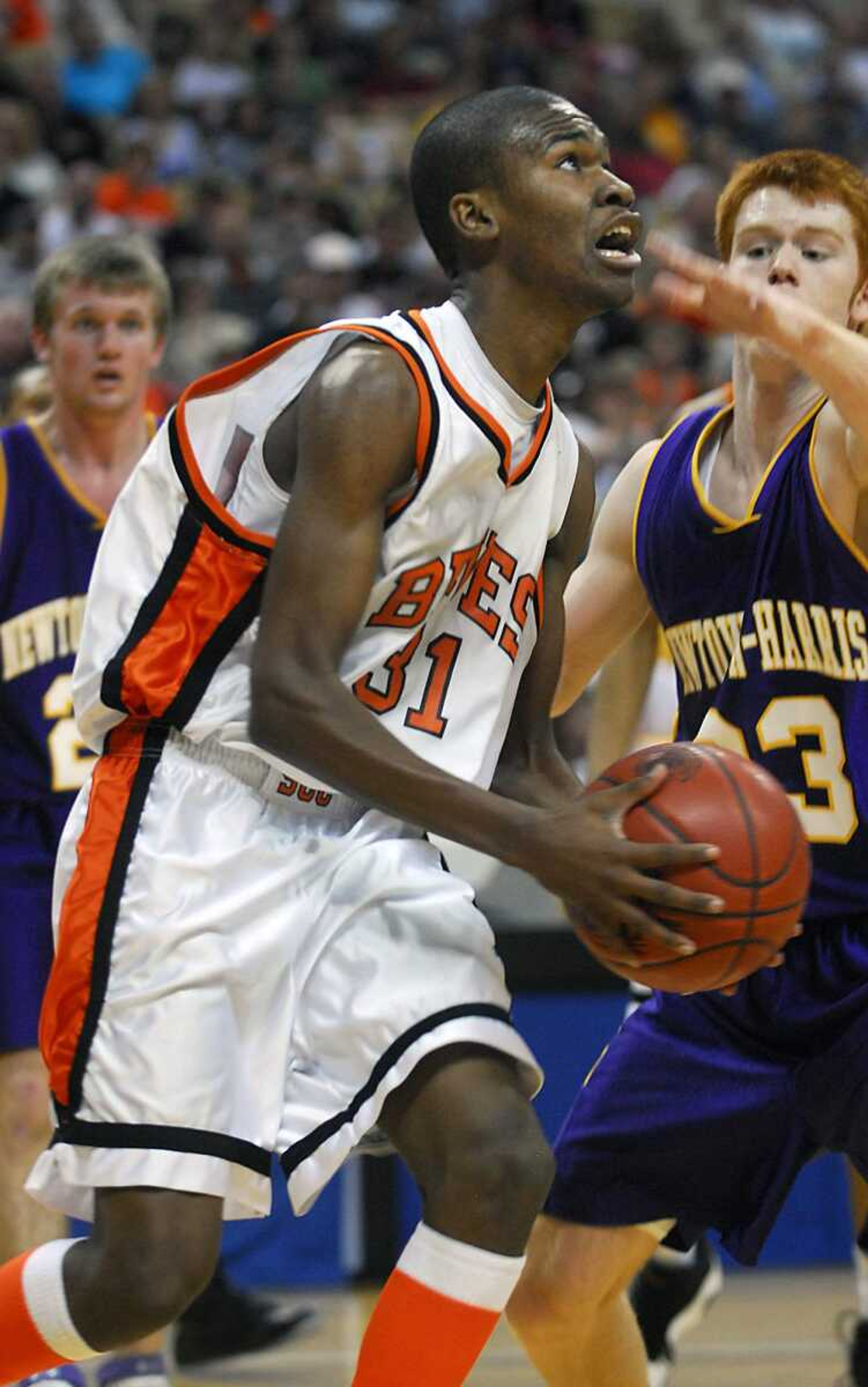 KIT DOYLE ~ kdoyle@semissourian.com
Chris Blissett eyes the basket as KJ Cool defends Saturday, March 21, 2009, in Columbia.