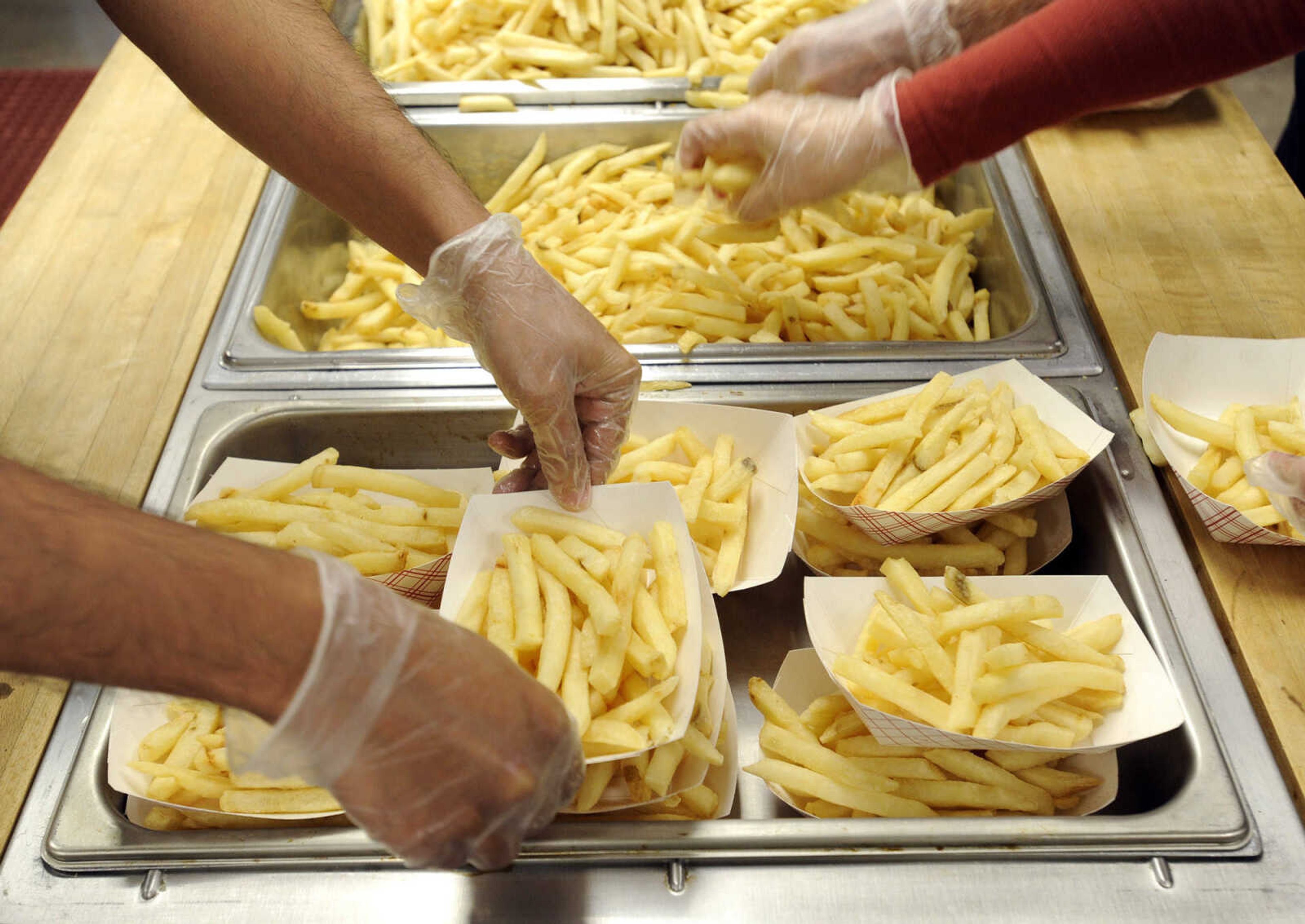 FRED LYNCH ~ flynch@semissourian.com
Baskets of French fries are assembled for the meals on Wimpy's Day Saturday, Sept. 19, 2015 at Centenary United Methodist Church in Cape Girardeau.