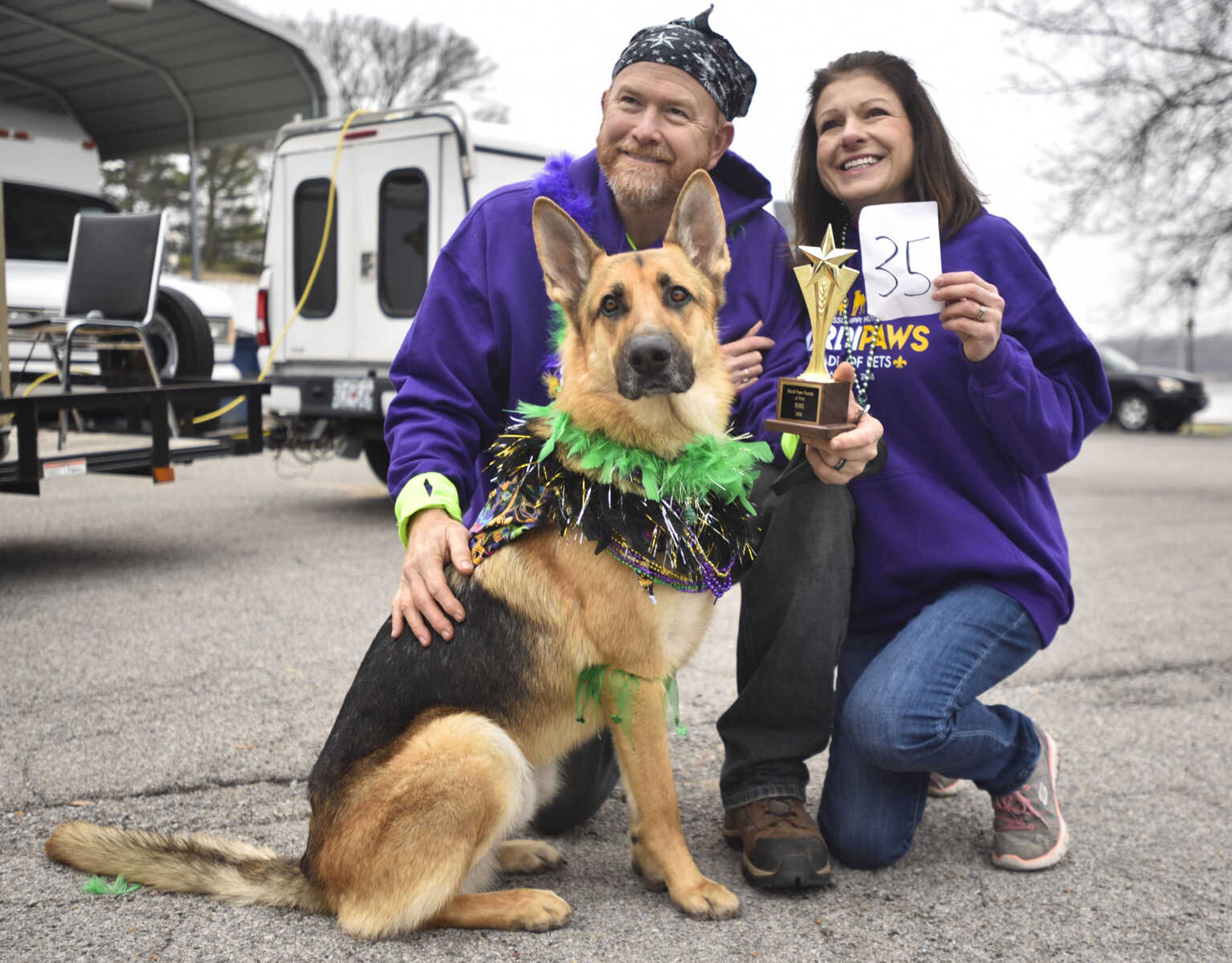 Bruce and Cindy Hanebrink kneel with their rescued german shepard, Smokey, after being crowned king at the 2nd annual Mardi Paws Parade of Pets on Sunday, March 18, 2018, in Cape Girardeau.