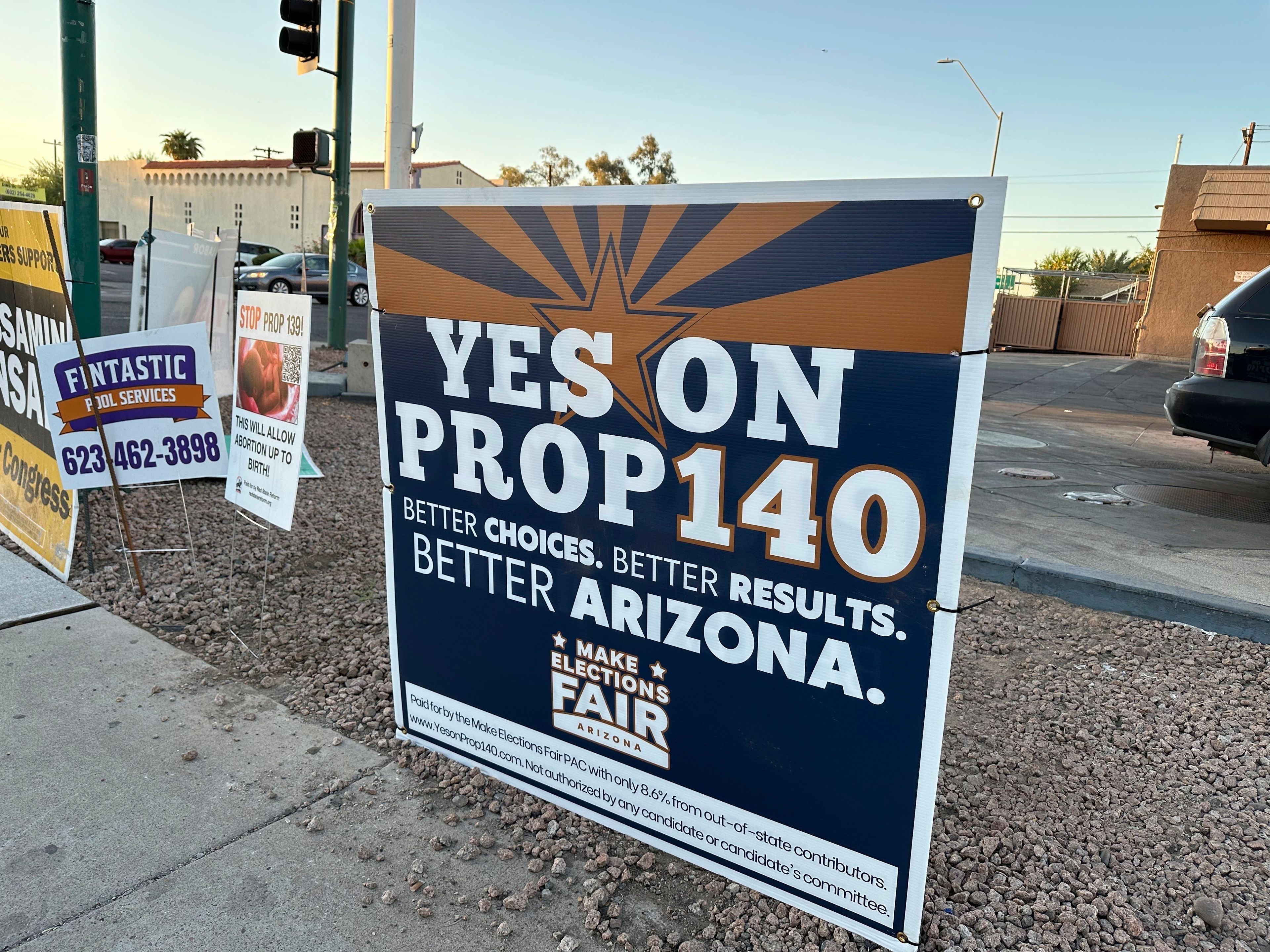 A yard sign is seen Thursday, Oct. 17, 2024, at a Phoenix intersection promoting Prop 140, which would establish an open primary system for Arizona elections. (AP Photo/Sejal Govindarao)