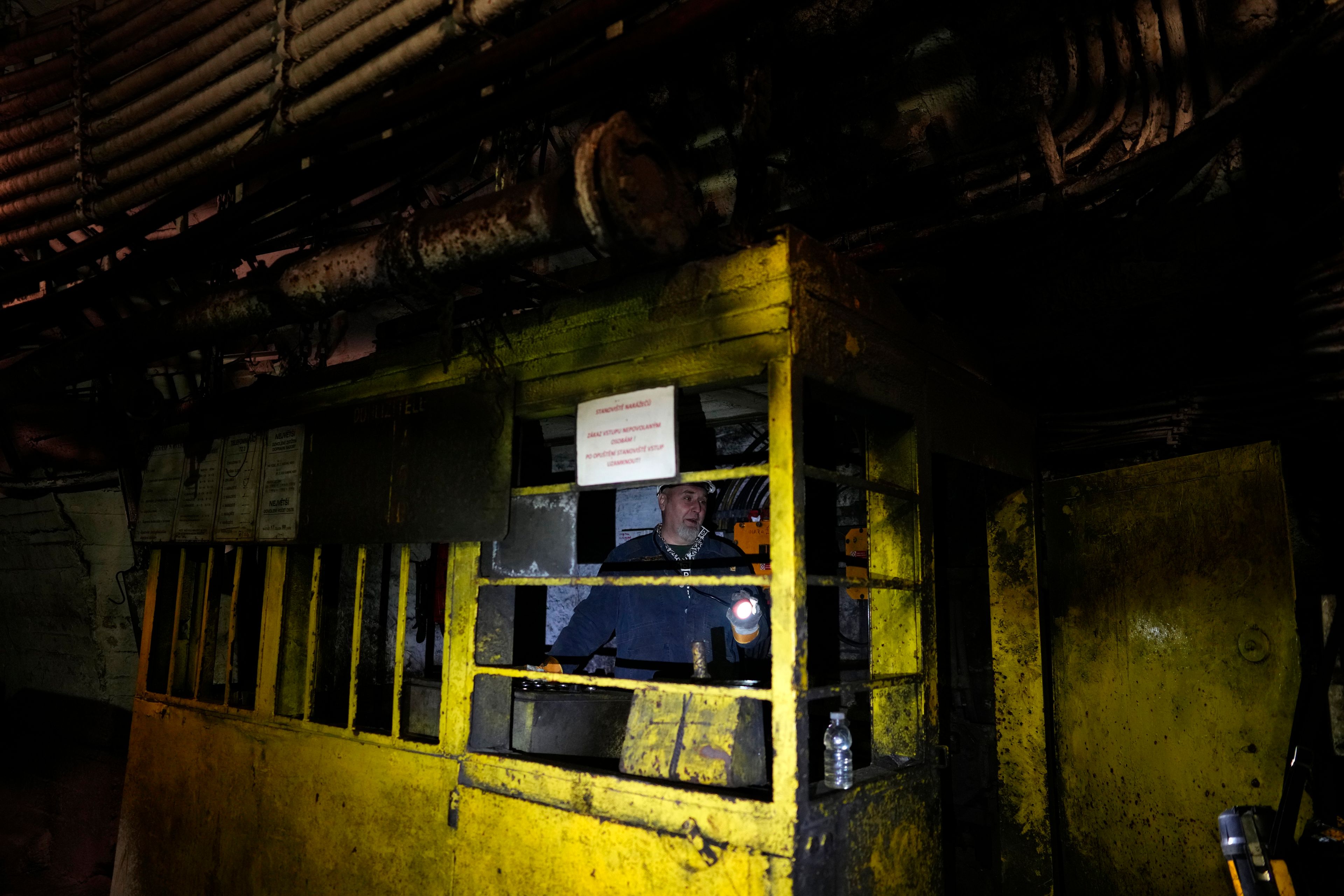 A miner uses his flashlight in a shaft of the CSM coal mine in Stonava, Czech Republic, Monday, Oct. 14, 2024. (AP Photo/Petr David Josek)