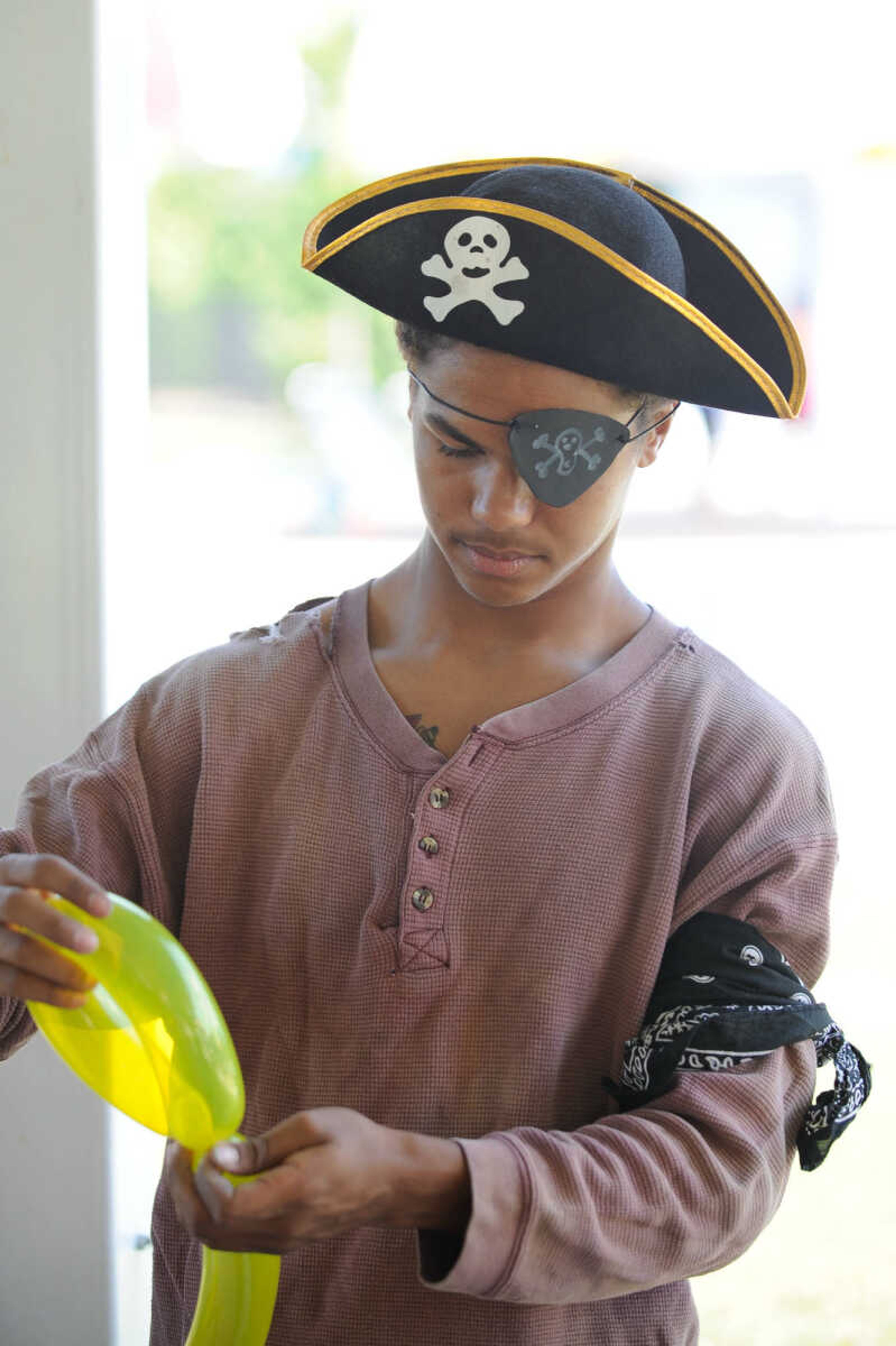 GLENN LANDBERG ~ glandberg@semissourian.com

Joseph Reed makes a balloon sword for young kids during the Mermaid and Pirate Party at Cape Splash Saturday, June 18, 2016 in Cape Girardeau.