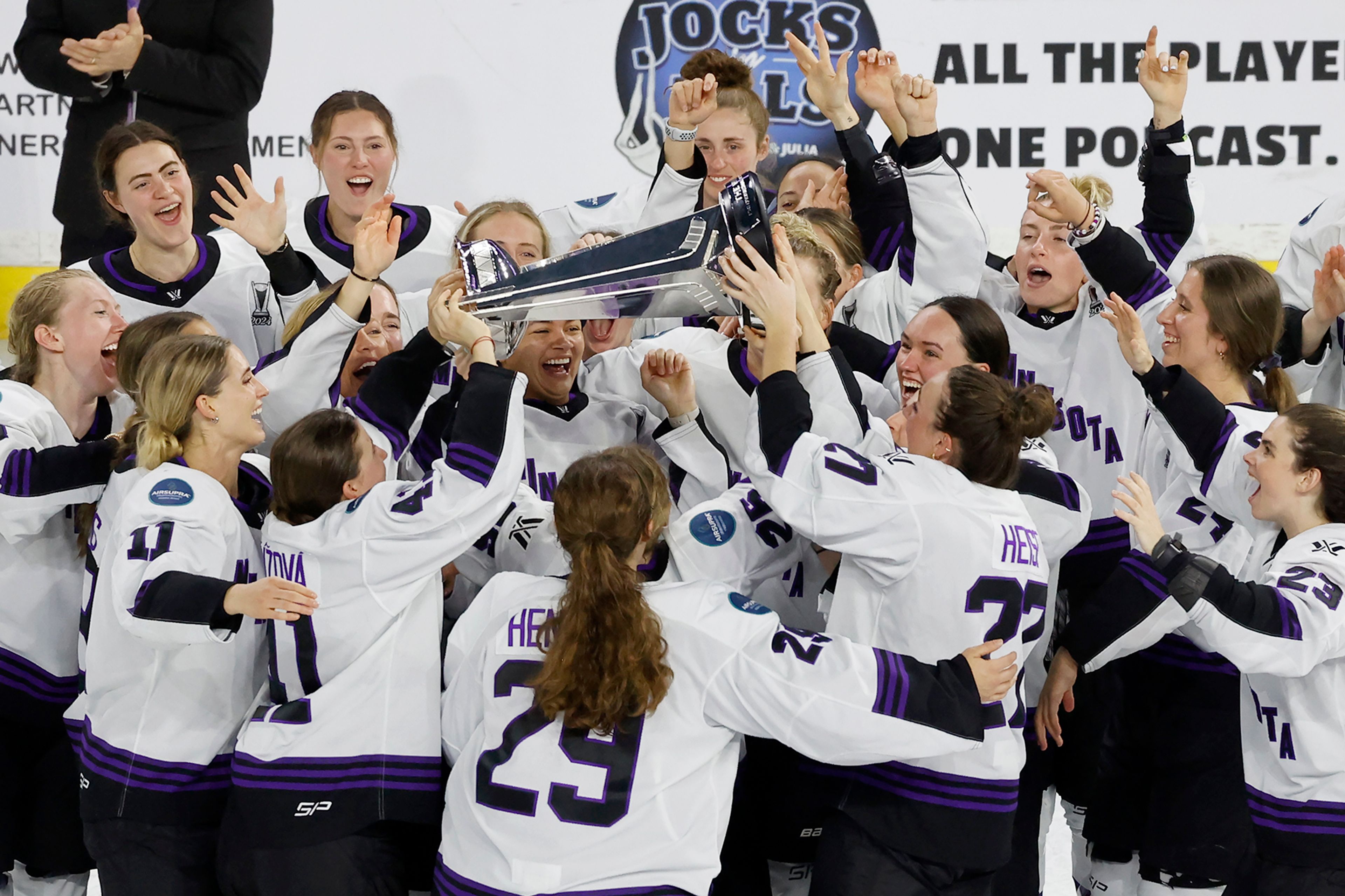 FILE - Minnesota players celebrate with the Walter Cup after defeating Boston to win the PWHL Walter Cup, May 29, 2024, in Lowell, Mass. (AP Photo/Mary Schwalm, File)