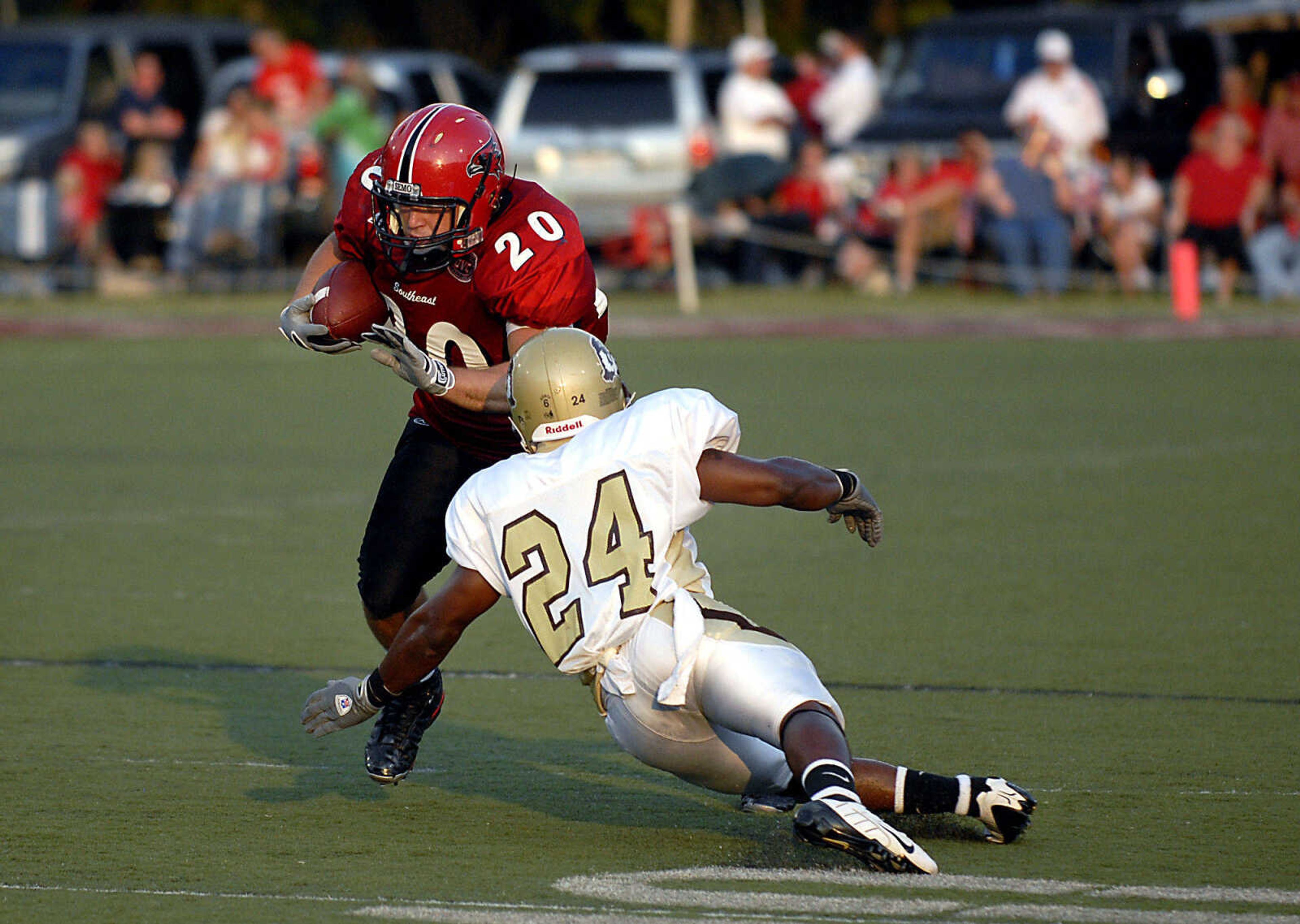 KIT DOYLE ~ kdoyle@semissourian.com
Nick Grassi evades the tackle of Quincy defender Erik Wilson Thursday, September 3, 2009, in the season opener at Houck Stadium.