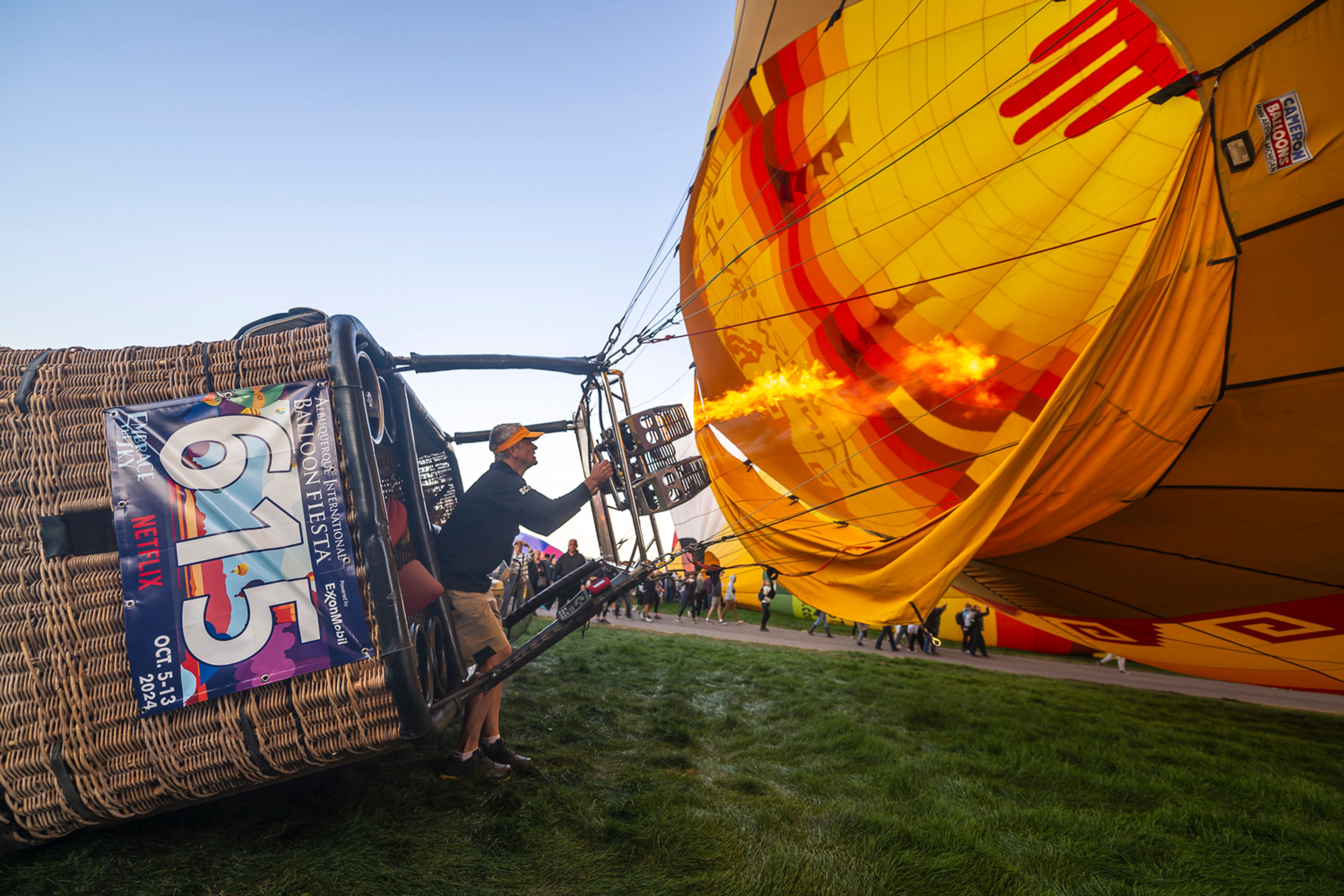 Pilot Brad Rice of Rio Rancho, N.M., prepares to take off in his balloon during the mass ascension at the 52nd Albuquerque International Fiesta in Albuquerque, N.M., on Saturday, Oct. 5, 2024. (AP Photo/Roberto E. Rosales)