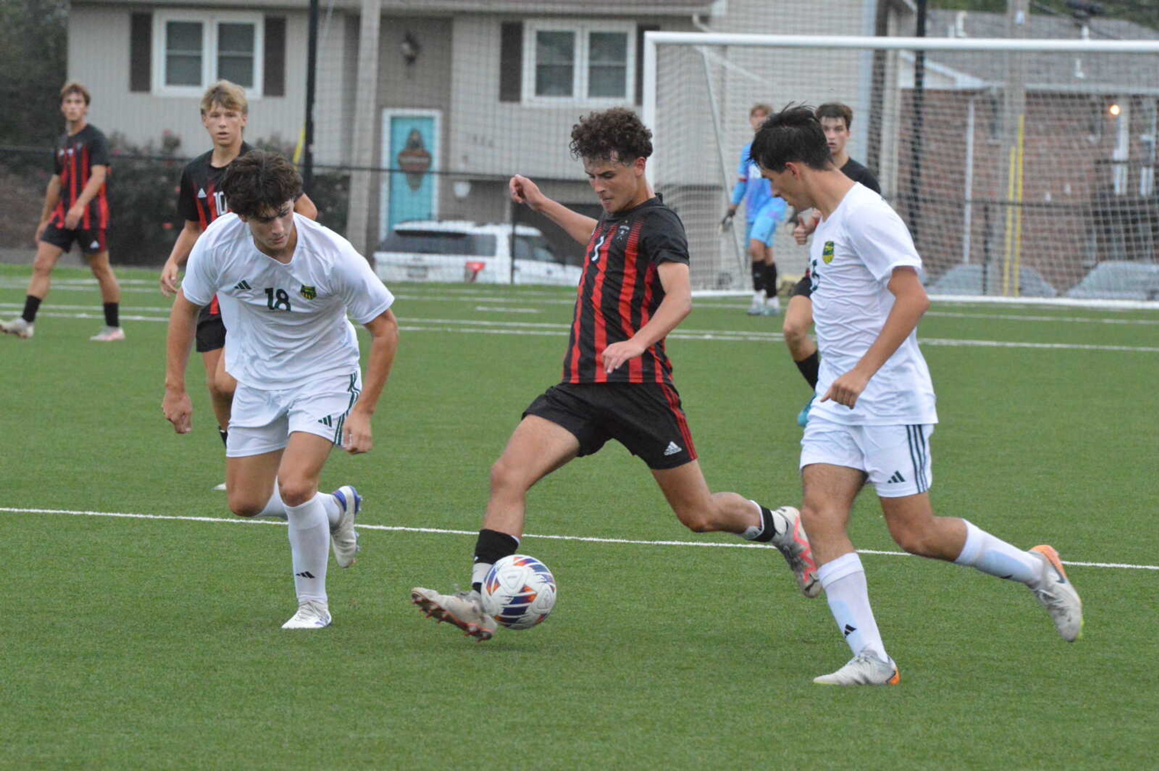 Jackson junior Dylan Strothmann passes the ball downfield to his Indian teammate against Lindbergh on Monday, Sept. 23, 2024. Strothmann's second-half goal off a penalty kick was the lone score for Jackson in the 3-1 loss. 