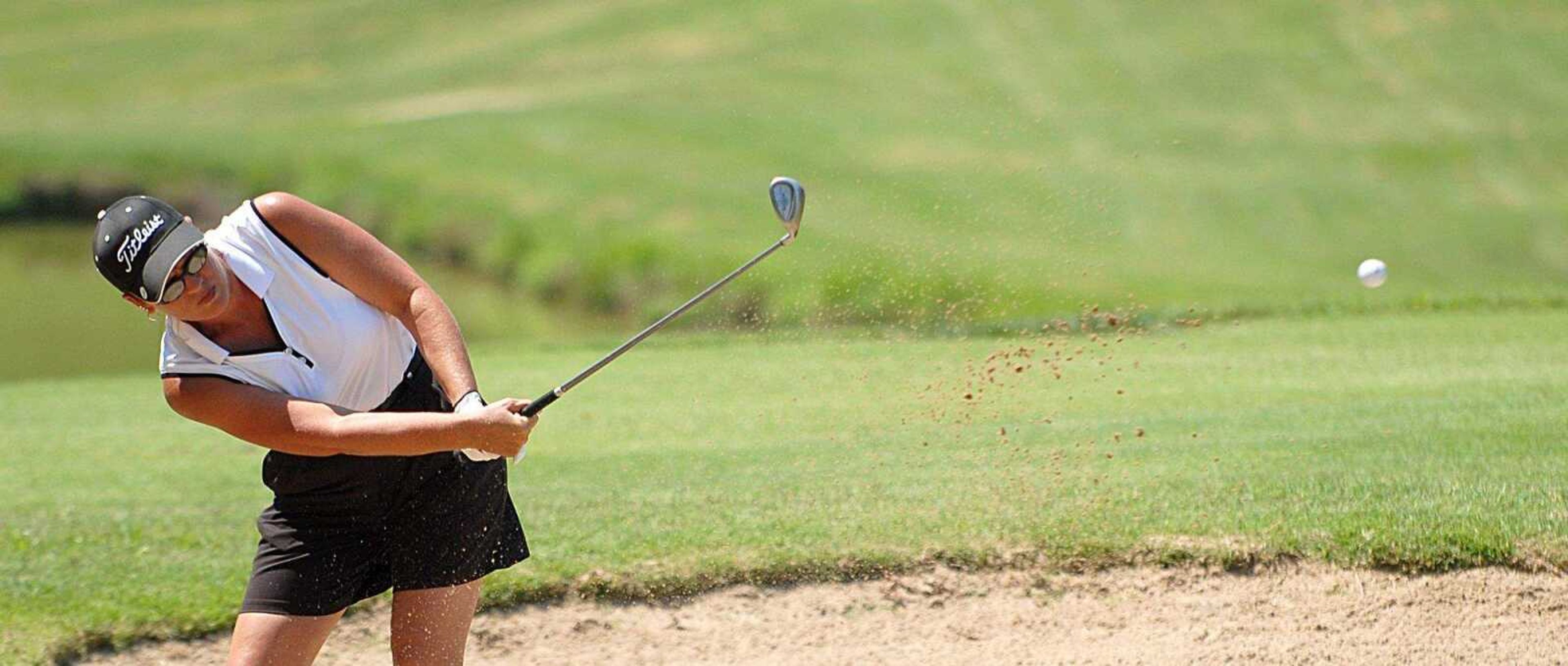 AARON EISENHAUER ~ aeisenhauer@semissourian.com
Diana King watches her ball after hitting it from the sand trap during the second round of the Lassie's Classic on Thursday, July 17, 2008 at the Cape Girardeau Country Club.