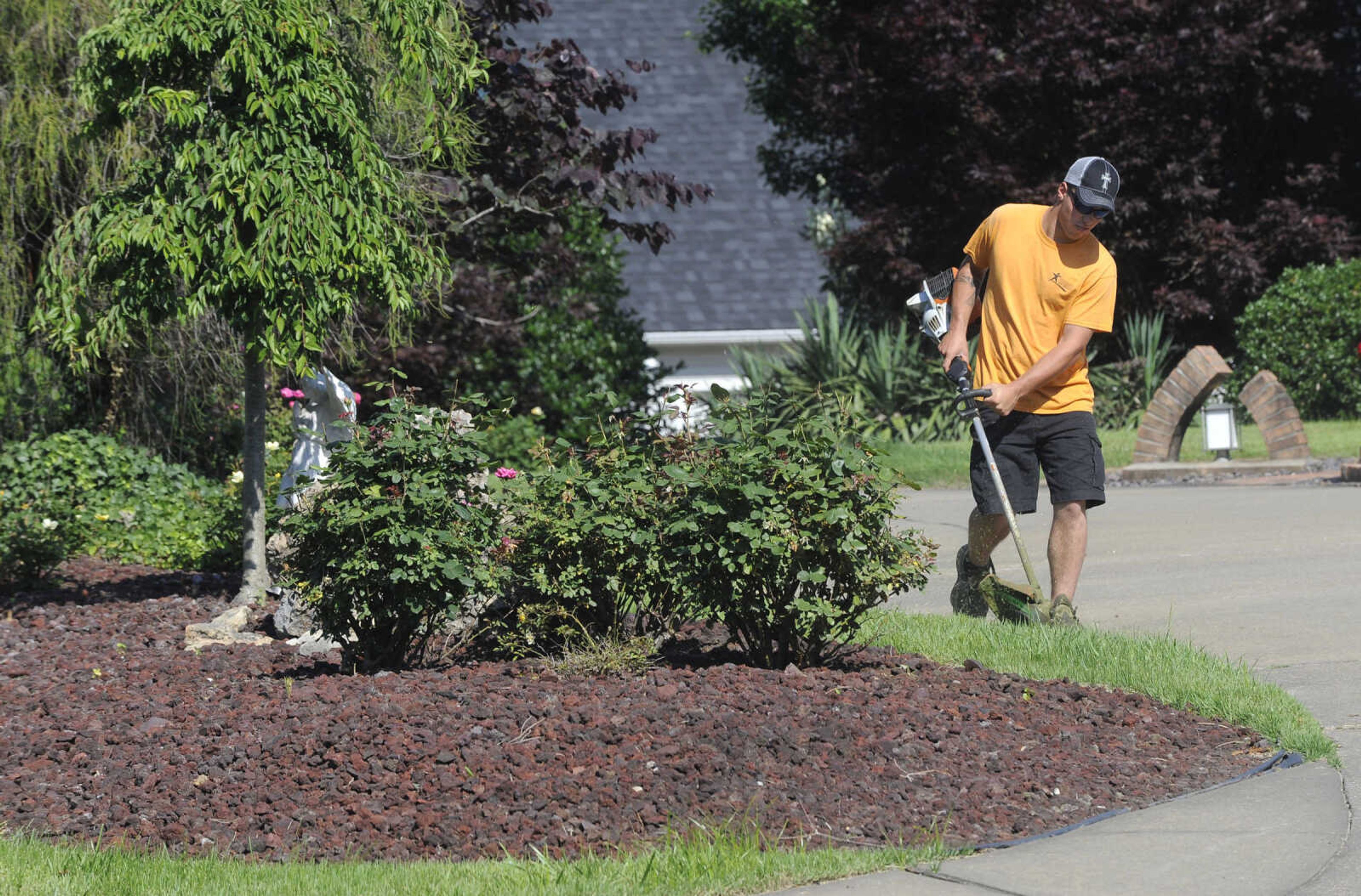 FRED LYNCH ~ flynch@semissourian.com
Joe Dattoli, a student at Adult and Teen Challenge Mid-America, trims along the street Saturday, June 3, 2017 in Cape Girardeau.