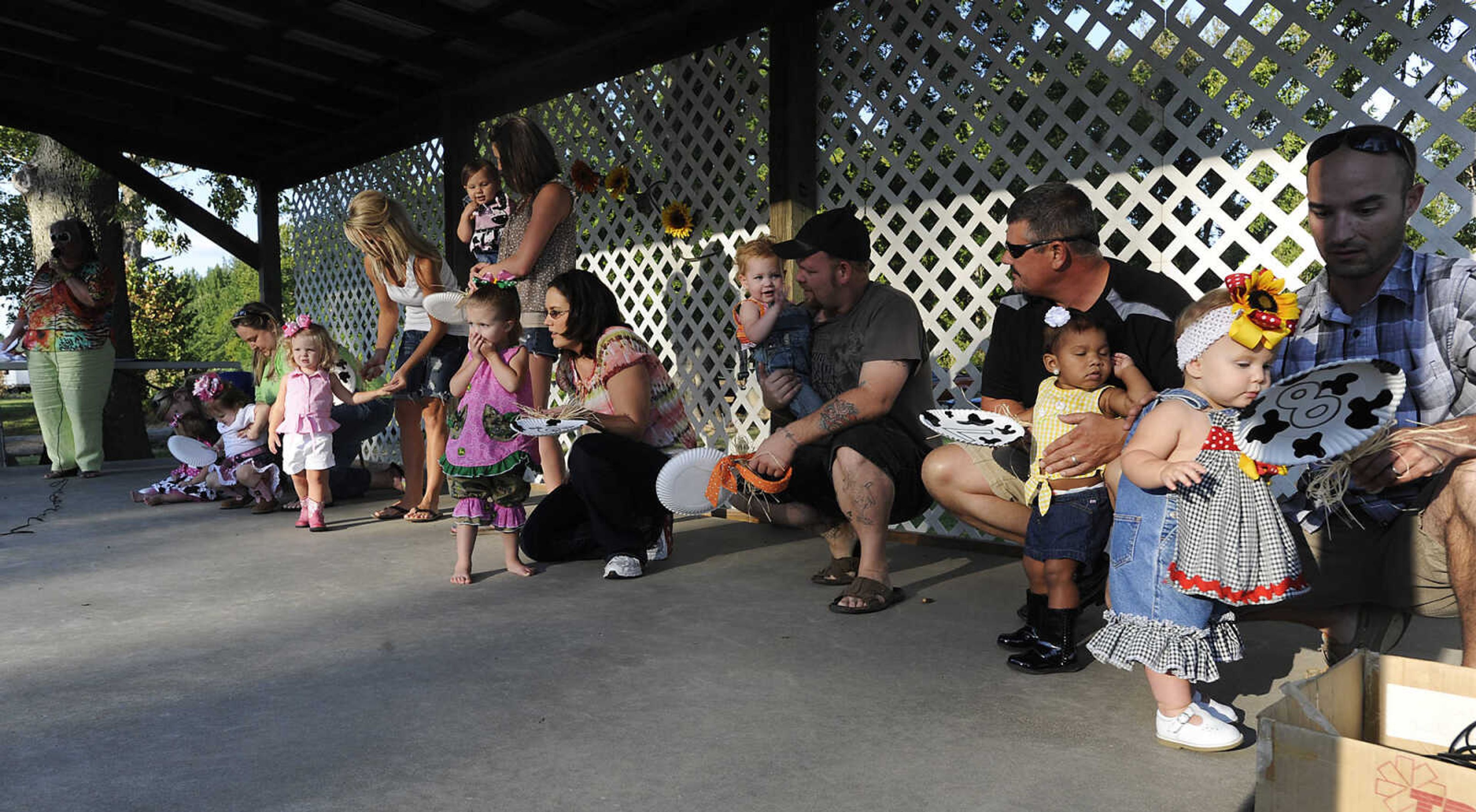 The judges take one last look at the contestants during the Mini Miss German Days Pageant during Chaffee's Annual German Days Festival Friday, August 10, at Frisco Park.