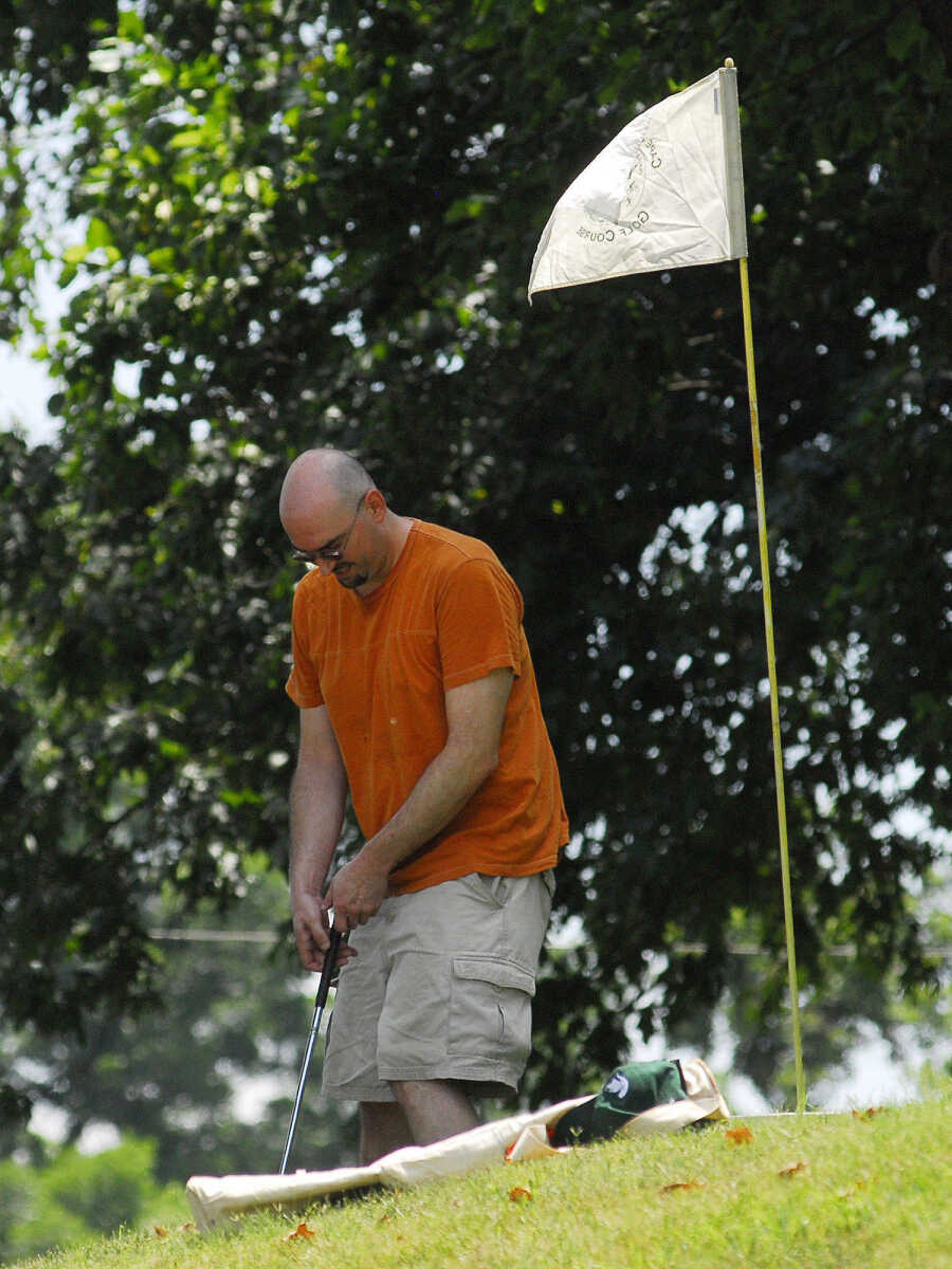 LAURA SIMON~lsimon@semissourian.com
Chad Mauk putts his BirdieBall towards the hole infront of the Common Pleas Courthouse Sunday, June 27, 2010 during the First-Ever Fifth Annual Louis J. Lorimier World Famous Downtown Golf Tournament in Cape Girardeau.