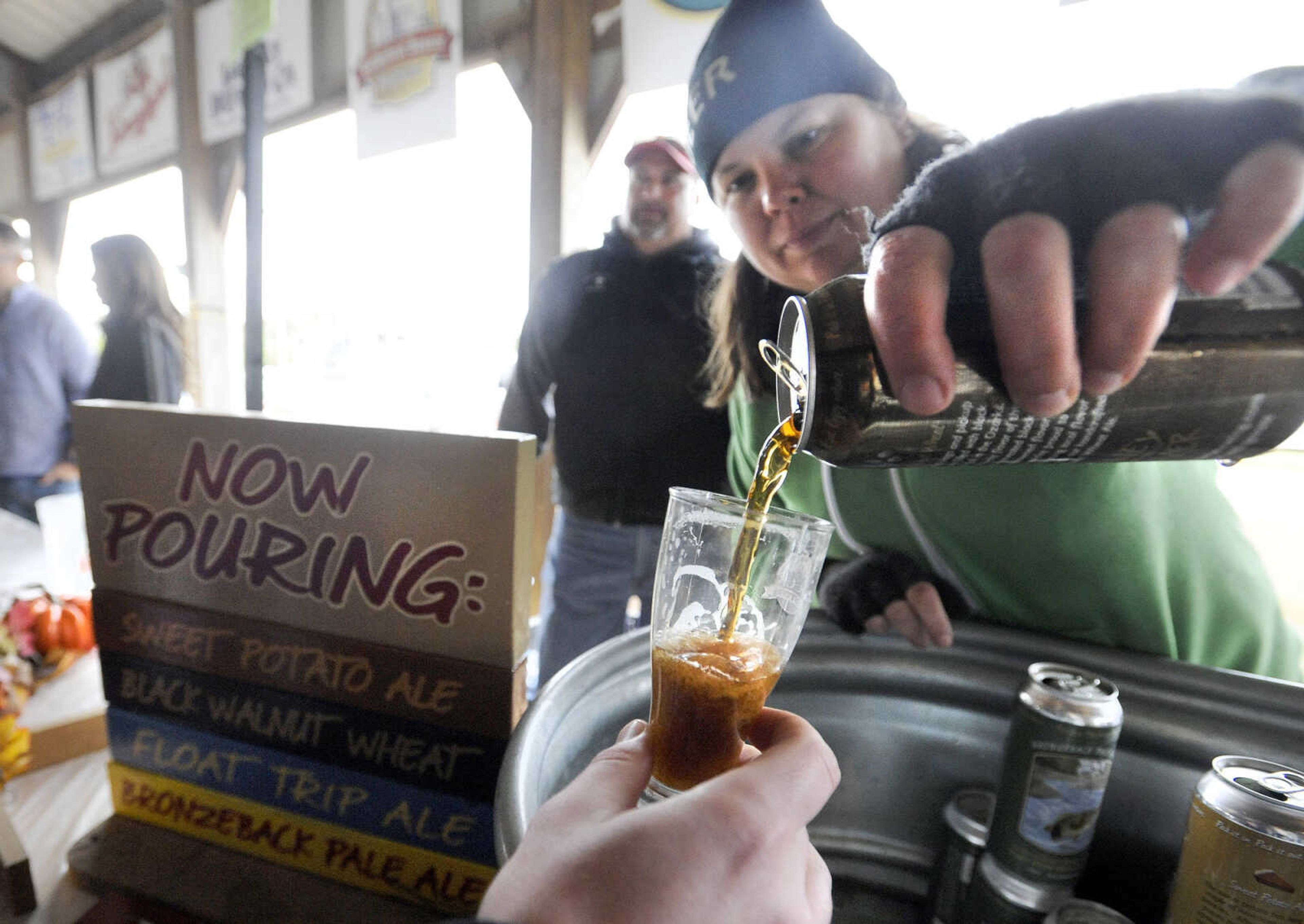 LAURA SIMON ~ lsimon@semissourian.com

Joleen Durham with Piney River Brewing Co. pours a sample, Saturday, Oct. 3, 2015, during the Community Counseling Center Foundation's 4th annual Craft Beer Festival at Arena Park in Cape Girardeau.