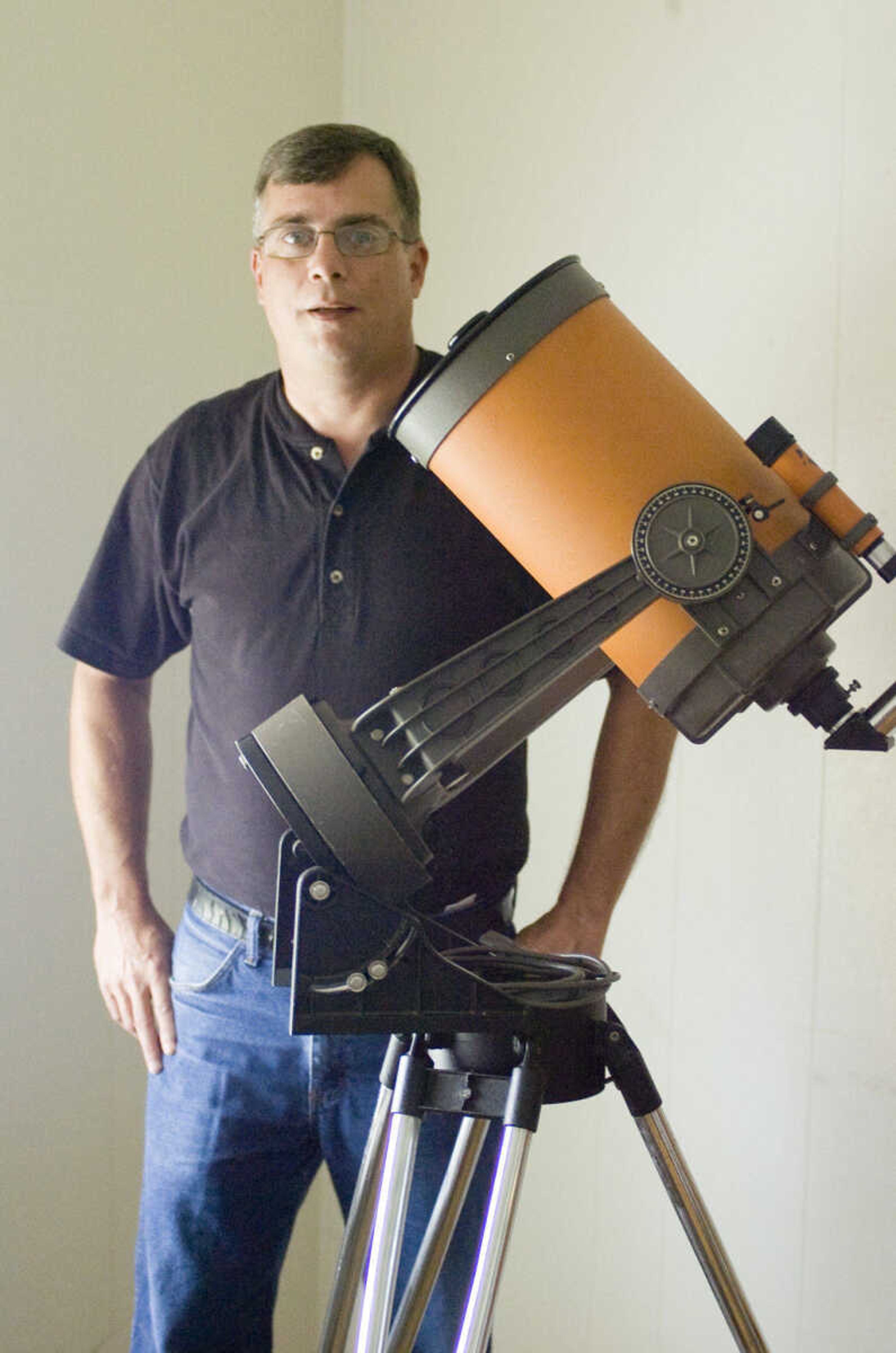 Ed Matott seen with his telescope. (Corey Matthews/Daily American Republic)