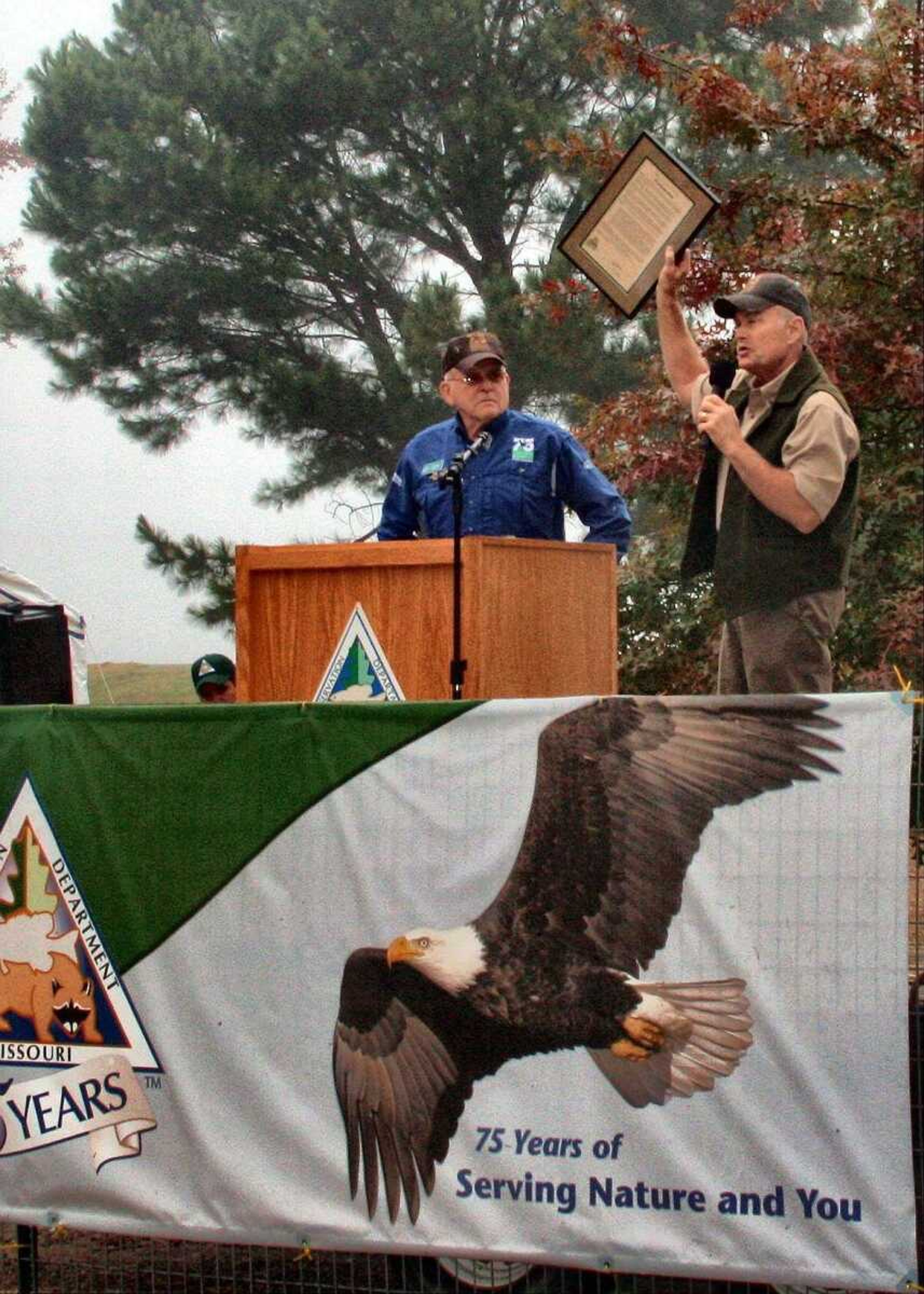 MDC Deputy Director, Tom Draper, presents a plaque to DU Missouri Chairman Dave Hakes. The Wetland Field Day held at Duck Creek Conservation Area on Saturday was a celebration of the 75-year anniversaries of MDC and DU.