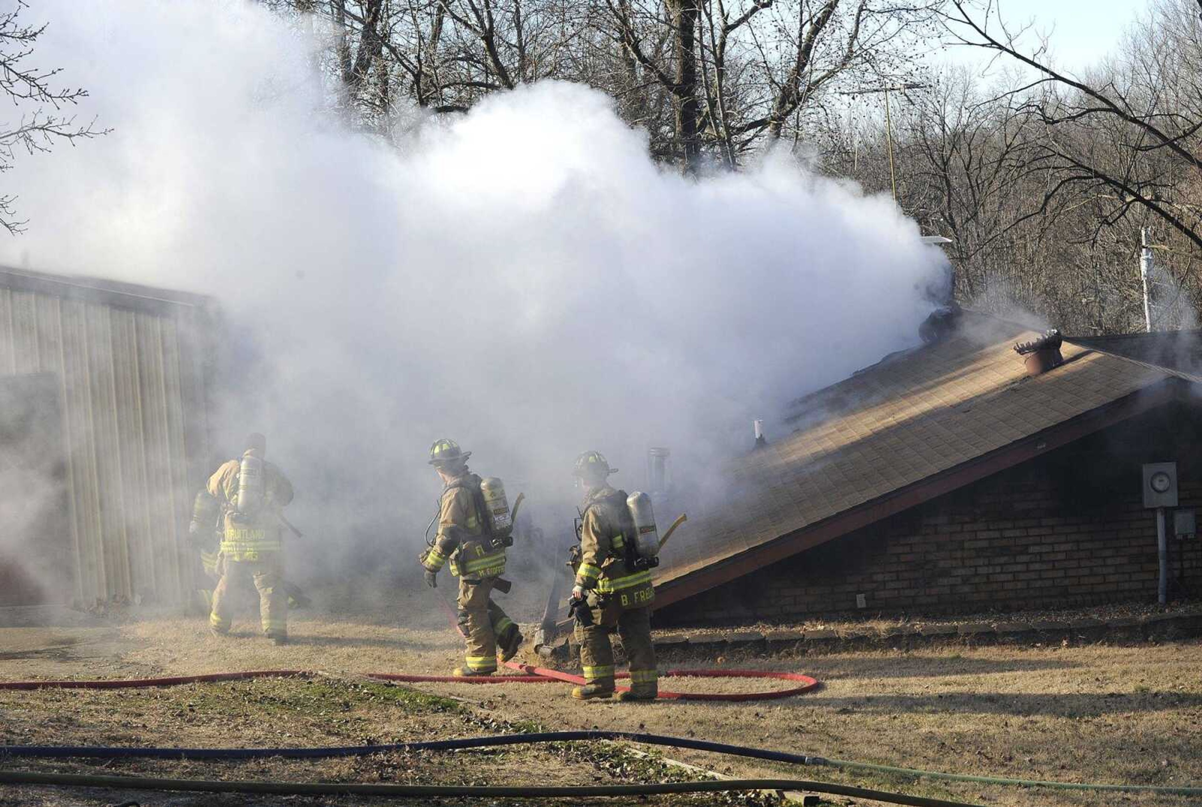 Fruitland firefighters assist the Jackson Fire Department at a house fire Monday at 648 Forest St. in Jackson.