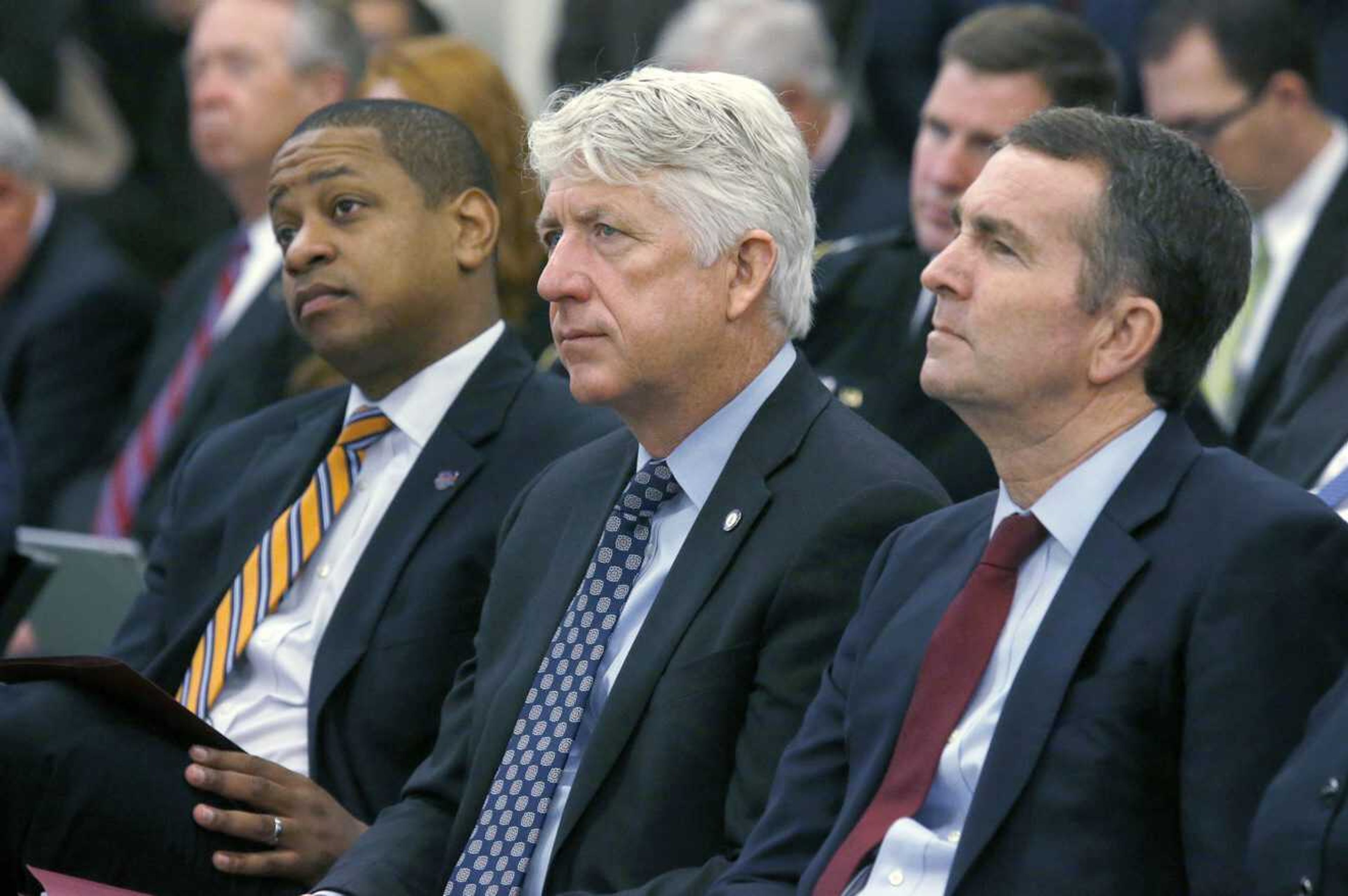 From left, Virginia Lt. Gov.-elect Justin Fairfax, Attorney General-elect Mark Herring and Gov.-elect Ralph Northam.  With the state's top three elected officials engulfed in scandal, fellow Democrats were rendered practically speechless, uncertain of how to thread their way through the racial and sexual allegations and their tangled political implications.