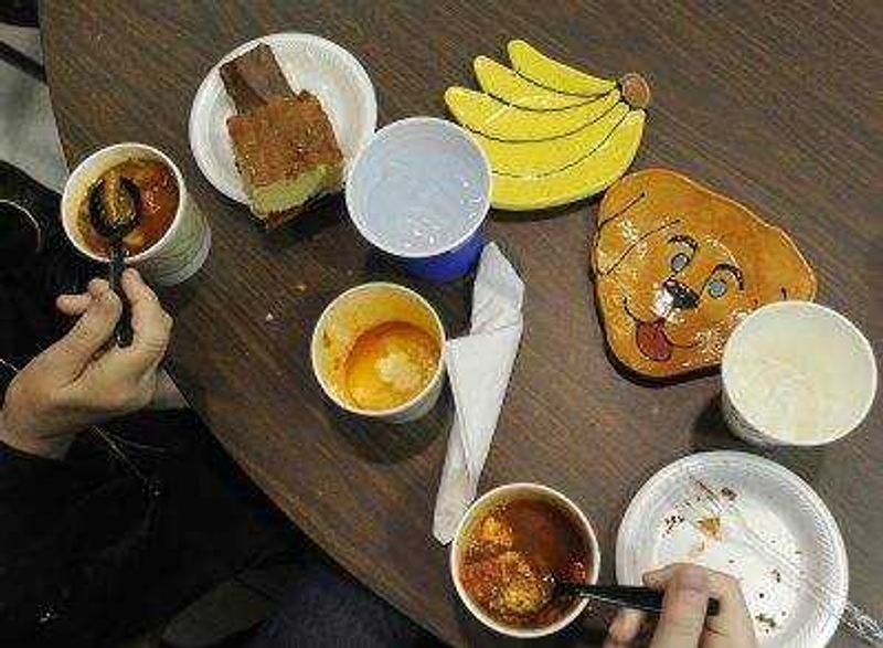 With bowl selections made, patrons enjoy the meal at the ninth annual Empty Bowls Banquet on Sunday at the Salvation Army Worship and Community Center in Cape Girardeau.