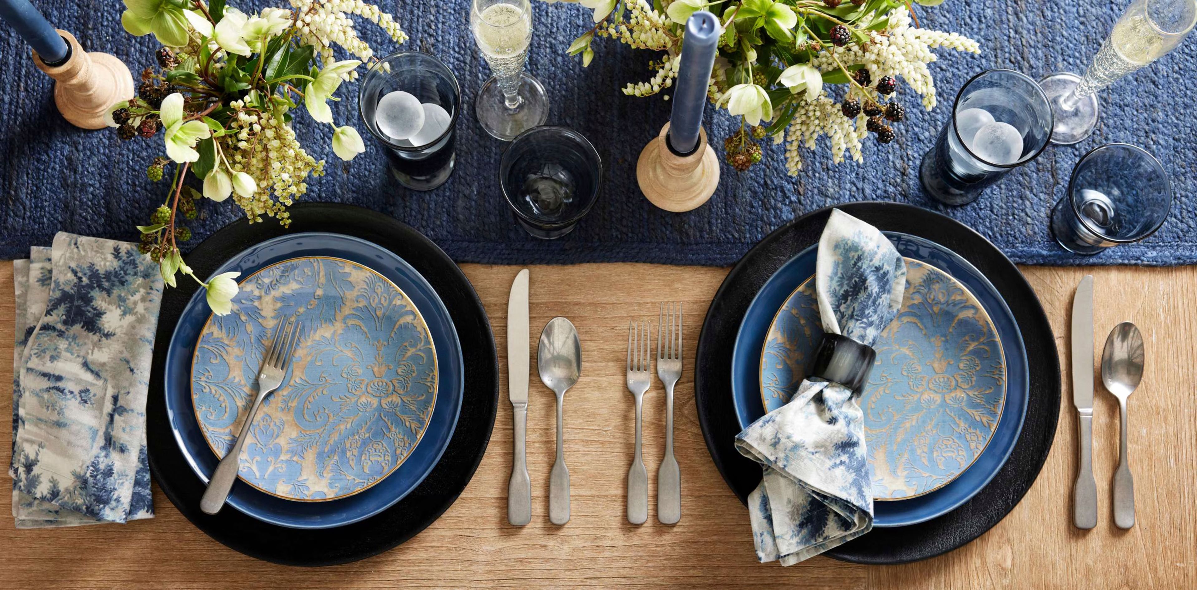 This image provided by Williams-Sonoma shows stoneware salad plates with a damask pattern that can be matched with blue or other plates. Having dishes that can be used for any type of dinner party means you don't need to buy or store too many. (Williams-Sonoma via AP)