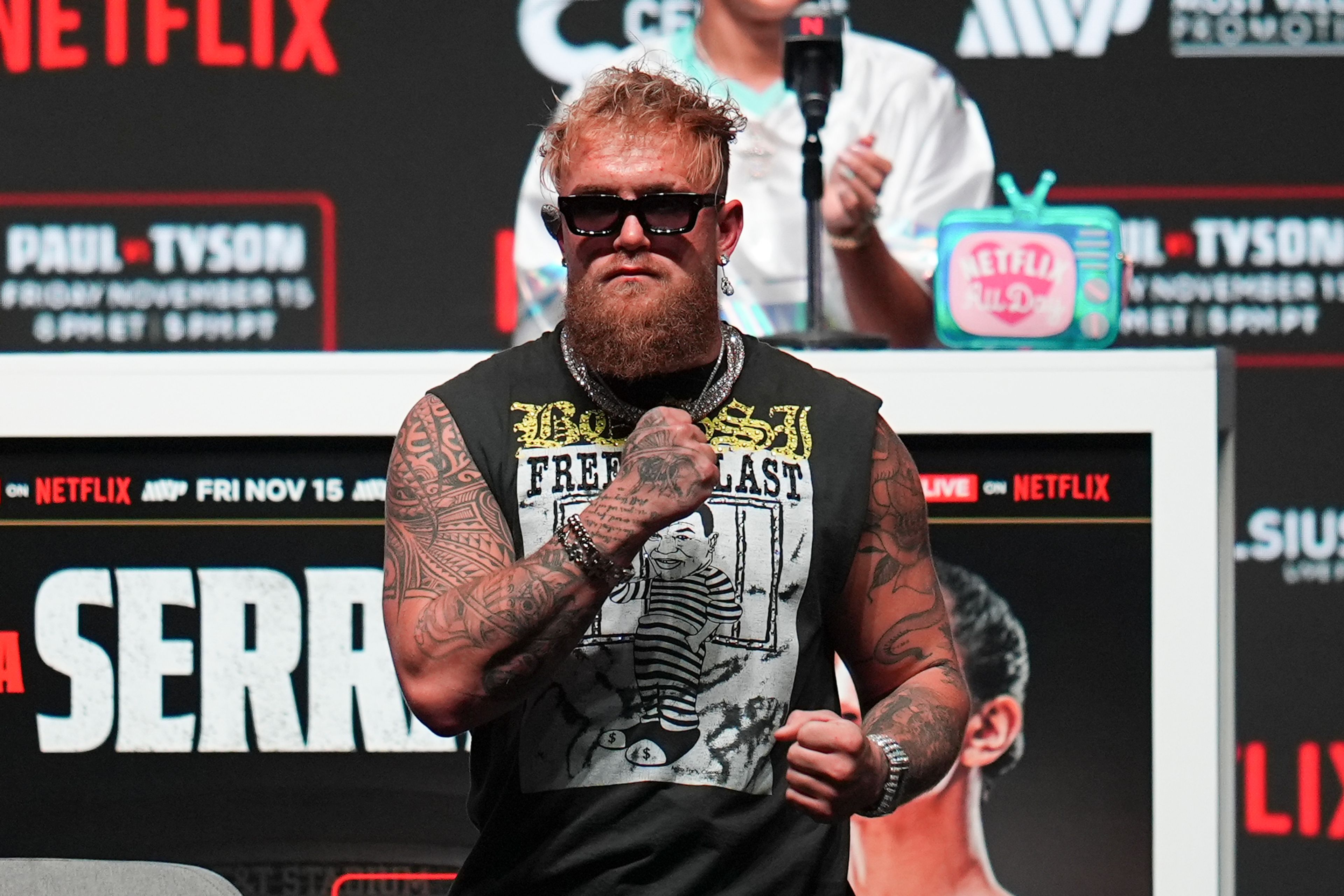 Jake Paul reacts during a news conference ahead of his fight against Mike Tyson, Wednesday, Nov. 13, 2024, in Irving, Texas. (AP Photo/Julio Cortez)