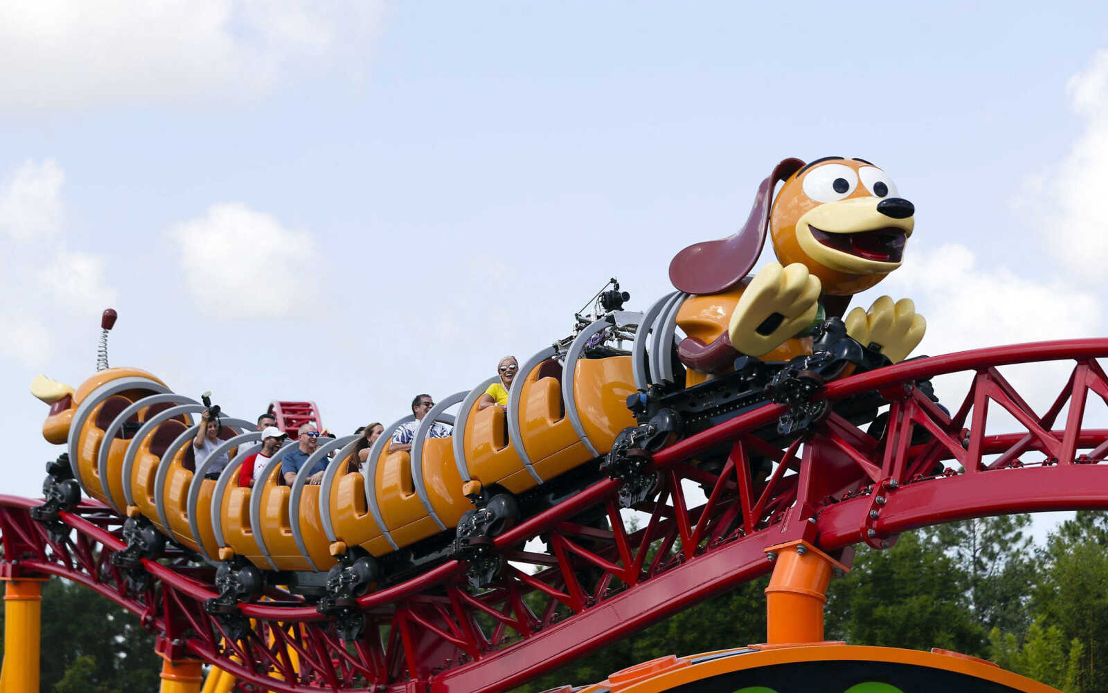 Guests ride the Slinky Dog Dash coaster Saturday at Toy Story Land in Disney's Hollywood Studios at Walt Disney World in Lake Buena Vista, Florida.