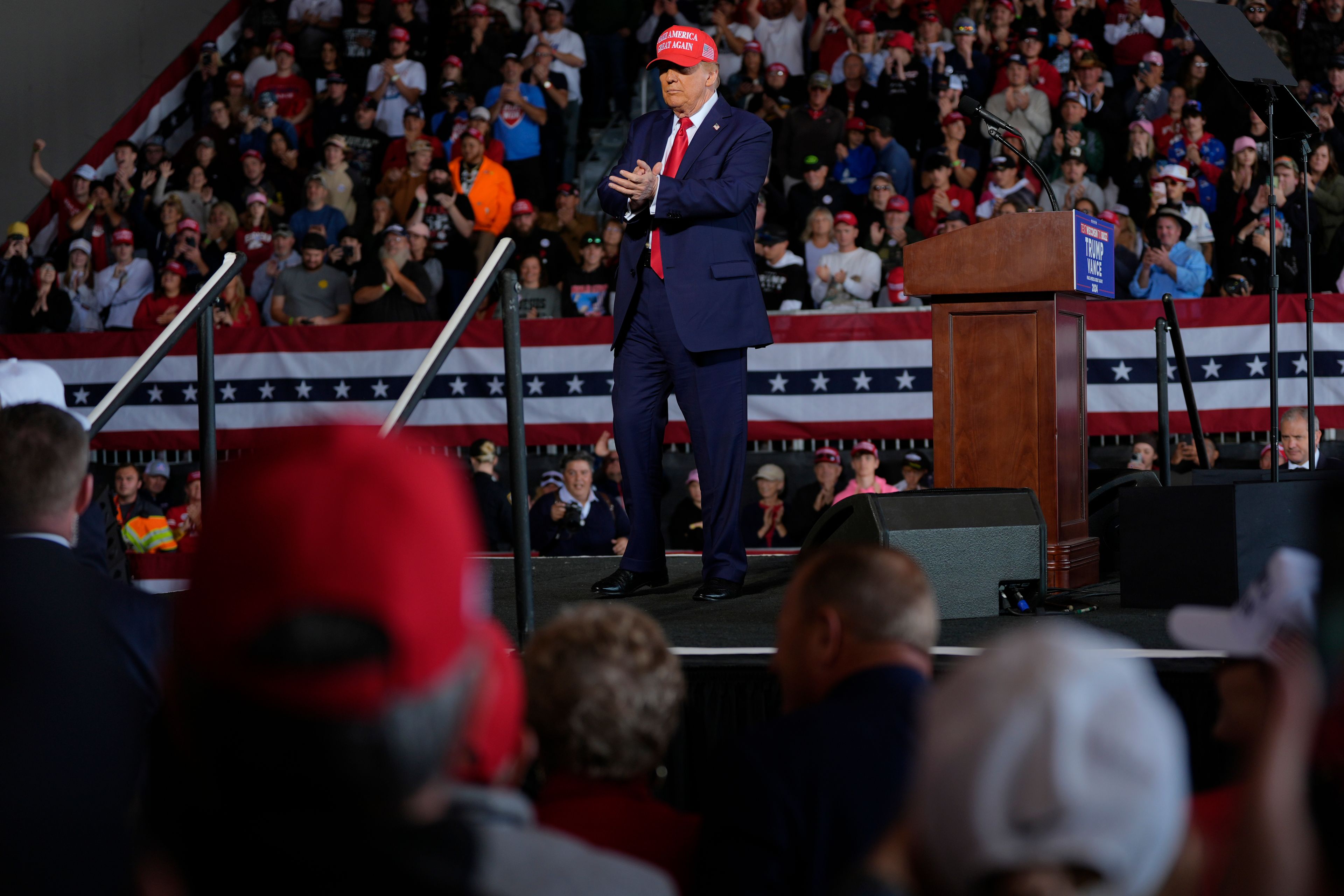 Republican presidential nominee former President Donald Trump appears onstage stage at a campaign rally at Dodge County Airport, Sunday, Oct. 6, 2024, in Juneau, Wis. (AP Photo/Julia Demaree Nikhinson)