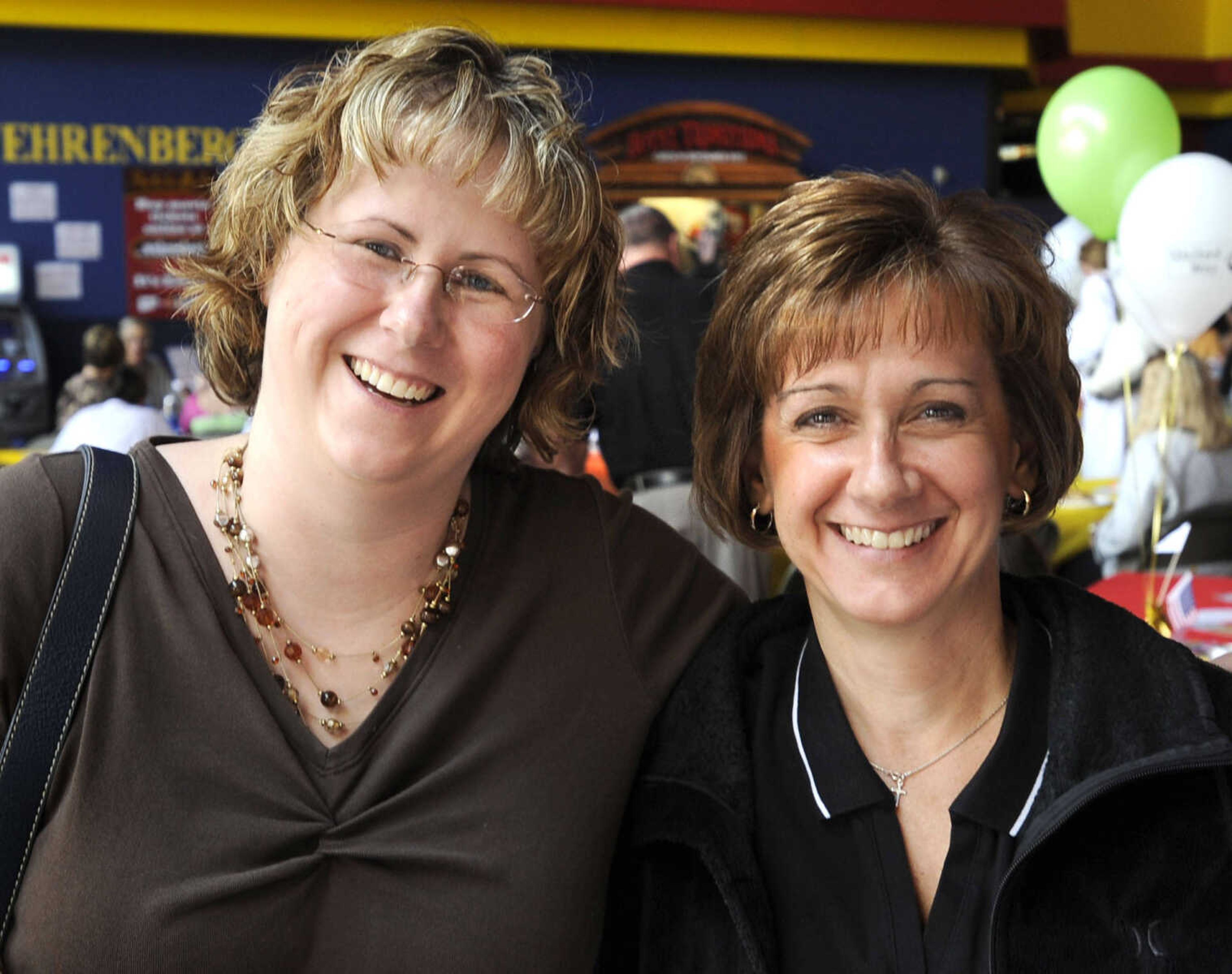 Heather Brooks, left, and Gayle Conrad pose at the United Way of Southeast Missouri campaign kickoff Aug. 30 at West Park 14 Cine.