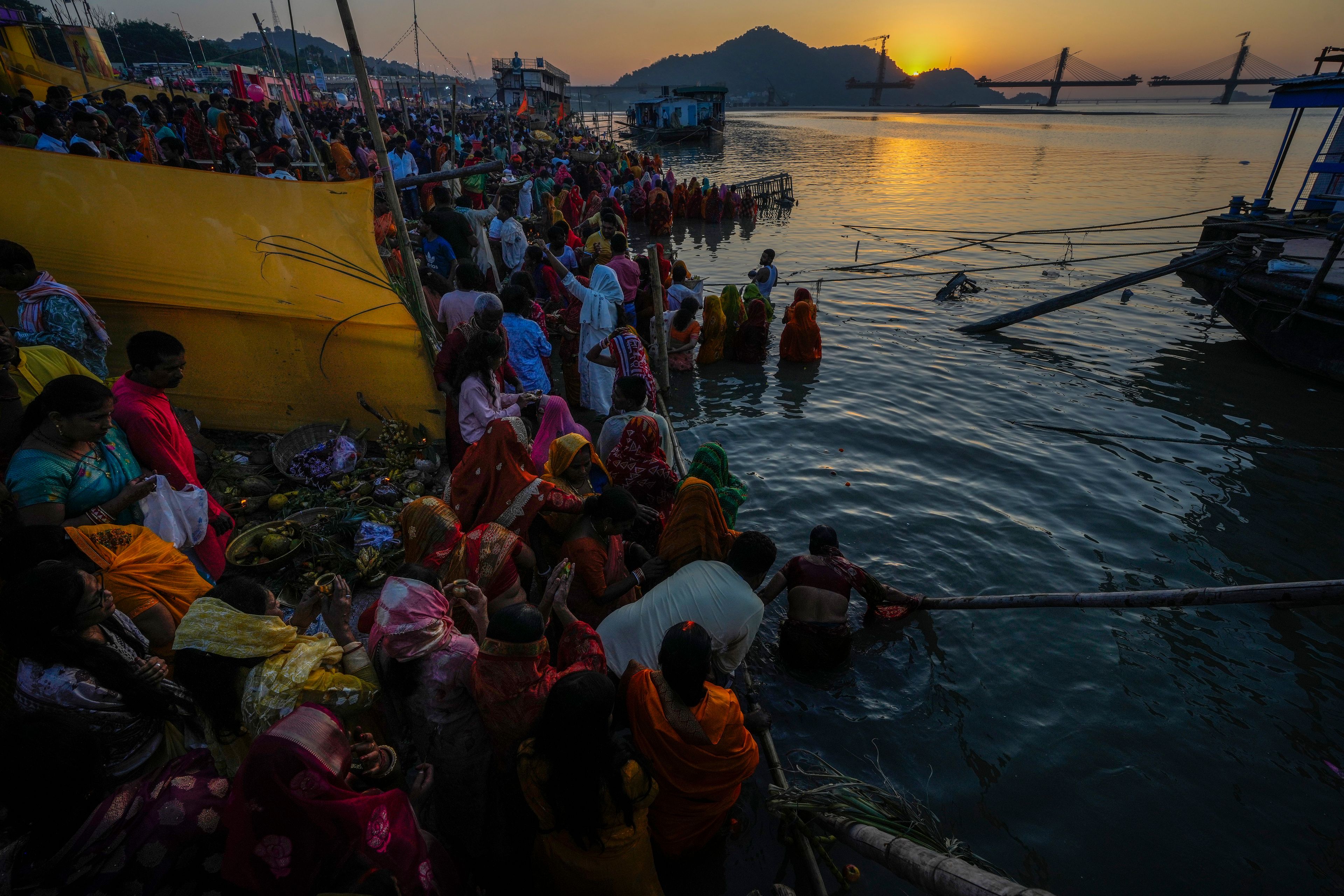 Hindu devotees gather by the river Brahmaputra and offer prayers during Chhath festival in Guwahati, northeastern Assam state, India, Thursday, Nov. 7, 2024. (AP Photo/Anupam Nath)