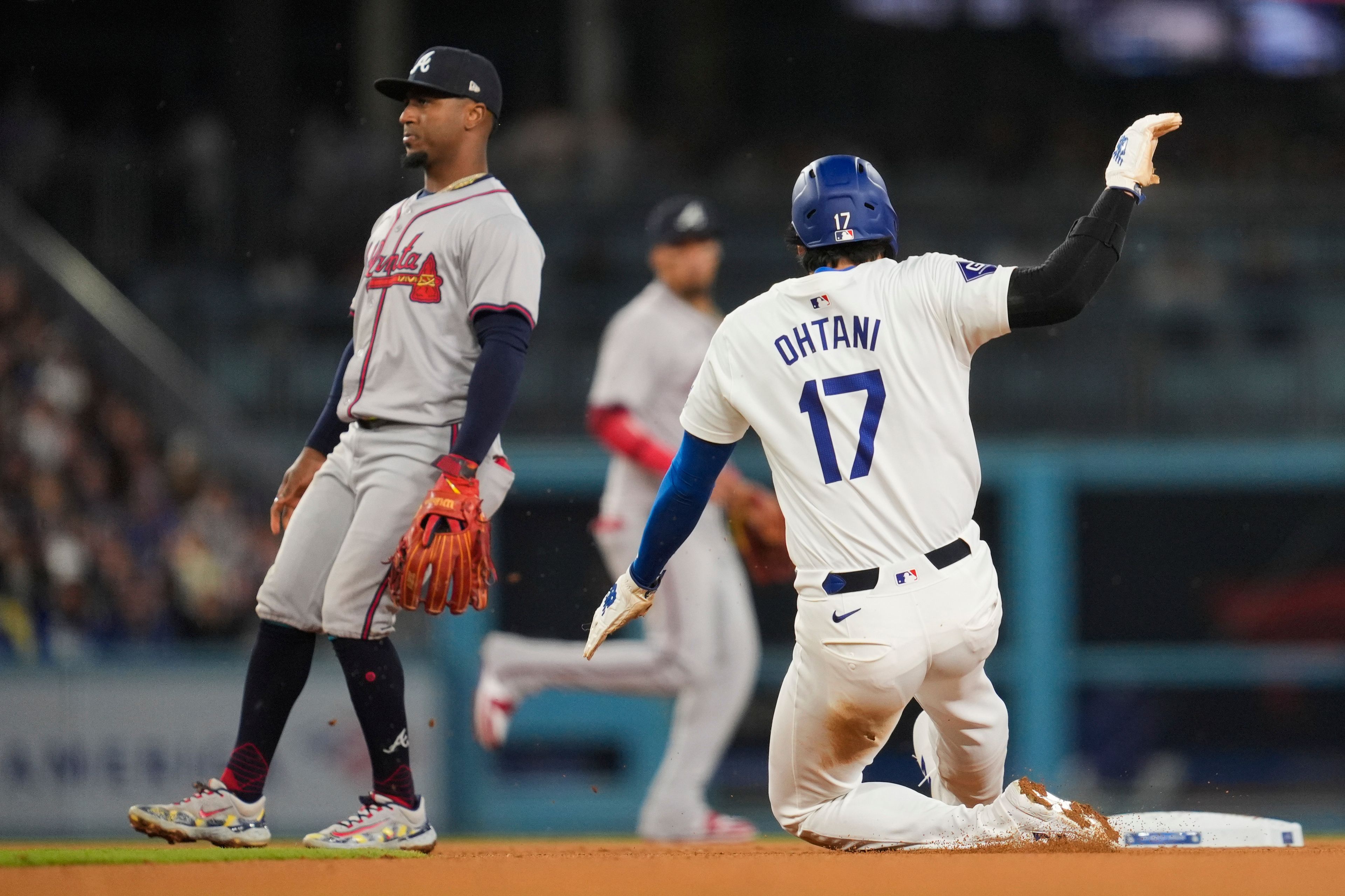 Los Angeles Dodgers designated hitter Shohei Ohtani (17) steals second during the eighth inning of a baseball game against the Atlanta Braves in Los Angeles, Friday, May 3, 2024. (AP Photo/Ashley Landis)