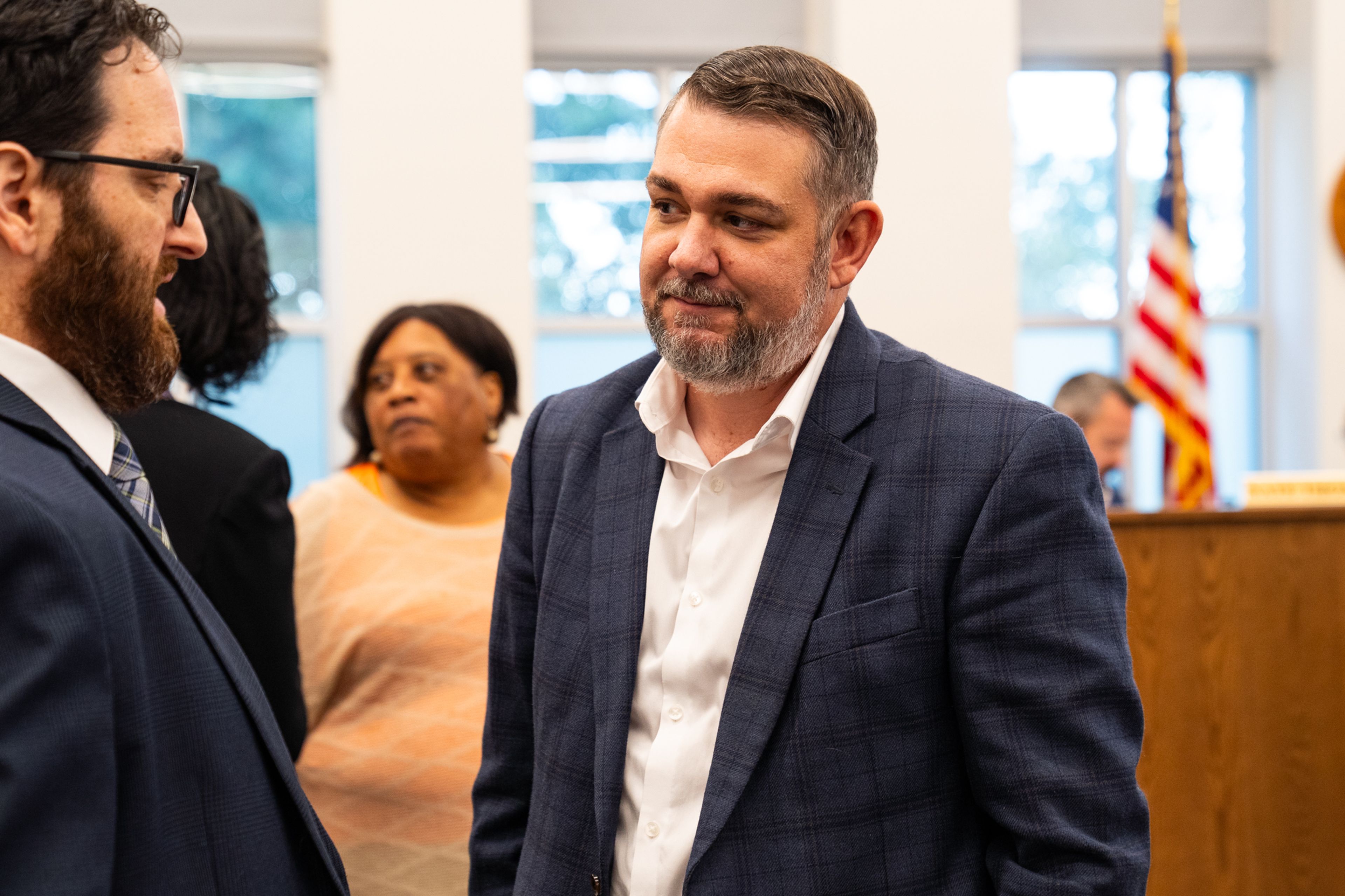 Ryan Essex speaks to city attorney Greg Young after being appointed interim Ward 5 councilman Monday, Oct. 7 at City Hall.