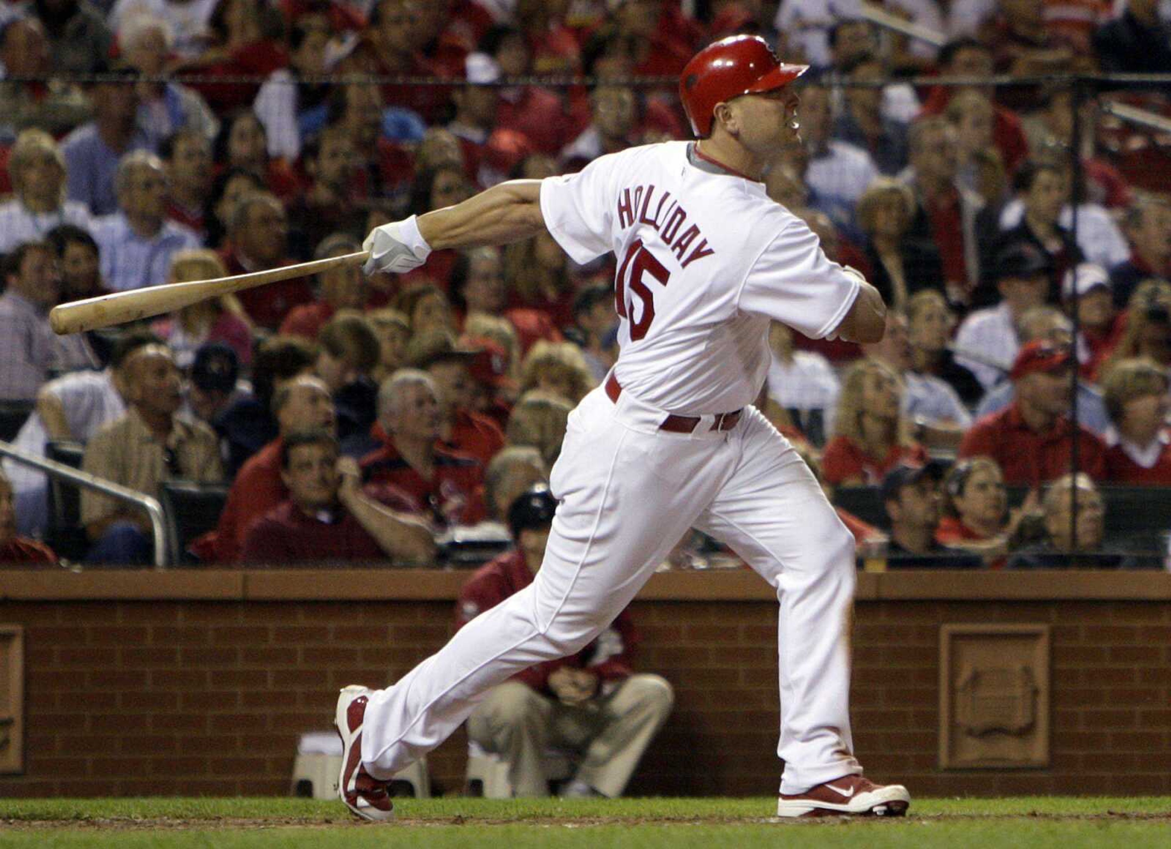 Cardinals outfielder Matt Holliday hits a three-run home run during the seventh inning Tuesday in St. Louis. (Jeff Roberson ~ Associated Press)