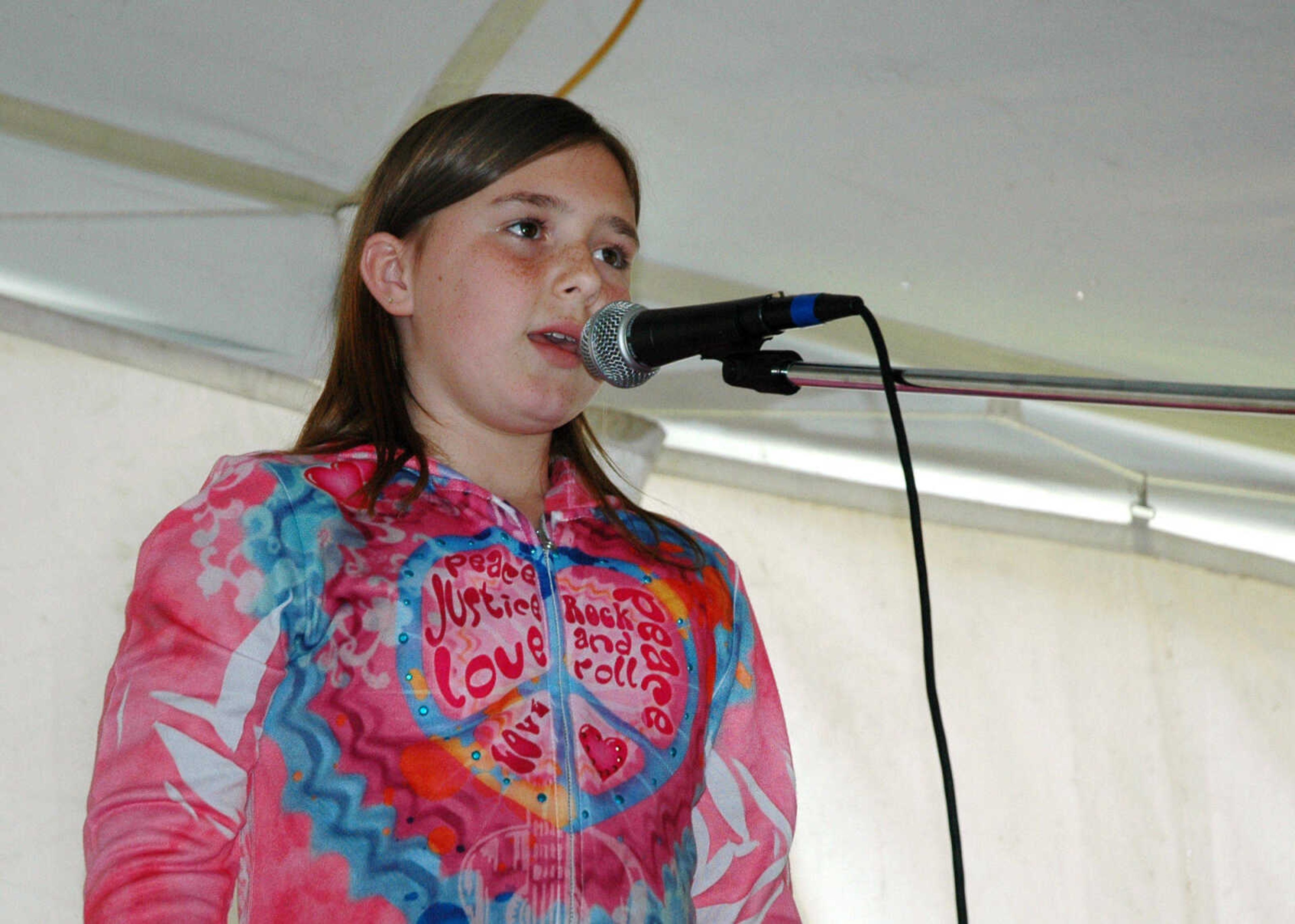 MELISSA MILLER ~ mmiller@semissourian.com

Jordan Huff, of Cape Girardeau, tells a story during "swapping ground" at the Storytelling Festival in Cape Girardeau, Mo., on Saturday, April 10, 2010. The swapping ground portion of the festival allows anyone the chance to take the stage and try their hand at storytelling.