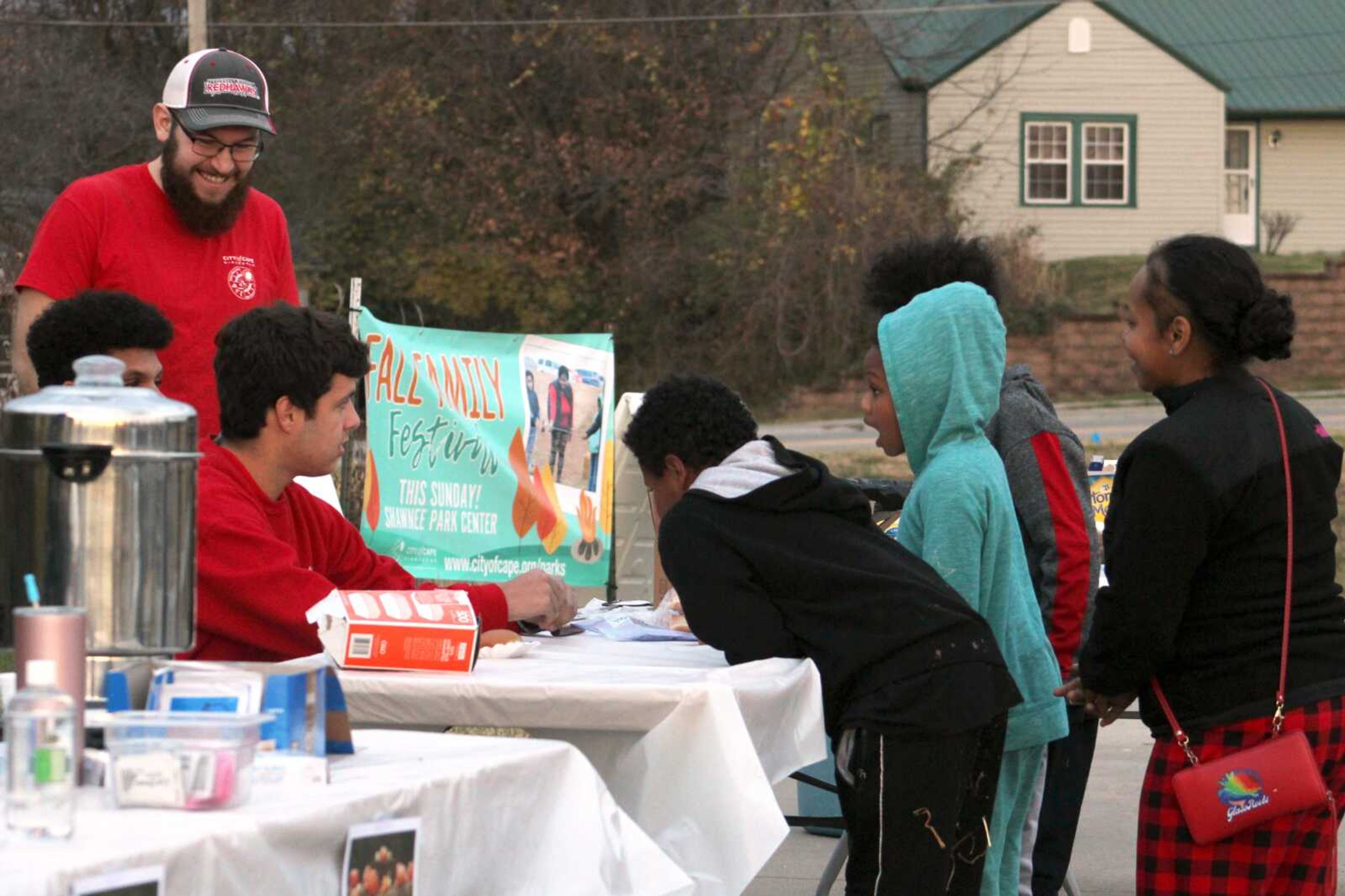 A group of children get supplies to make s'mores and hot dogs during Cape Girardeau Parks and Recreations Department's Fall Family Festival on Sunday at Shawnee Park Center in Cape Girardeau. The festival included hayrides, a bonfire, weenie roast, s'mores and more.