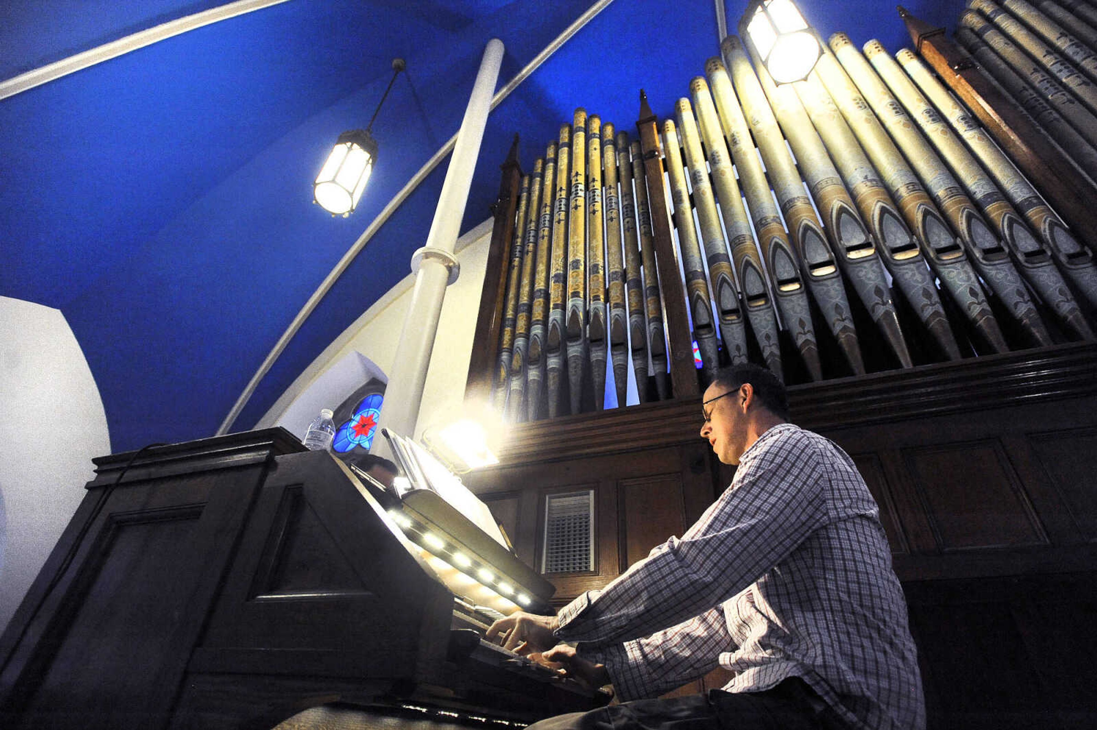 LAURA SIMON ~ lsimon@semissourian.com

Daniel Seiler, music director at St. John's Catholic Church in Leopold, Missouri, plays the organ during the first wedding inside the newly remodeled church on Saturday, May 21, 2016.