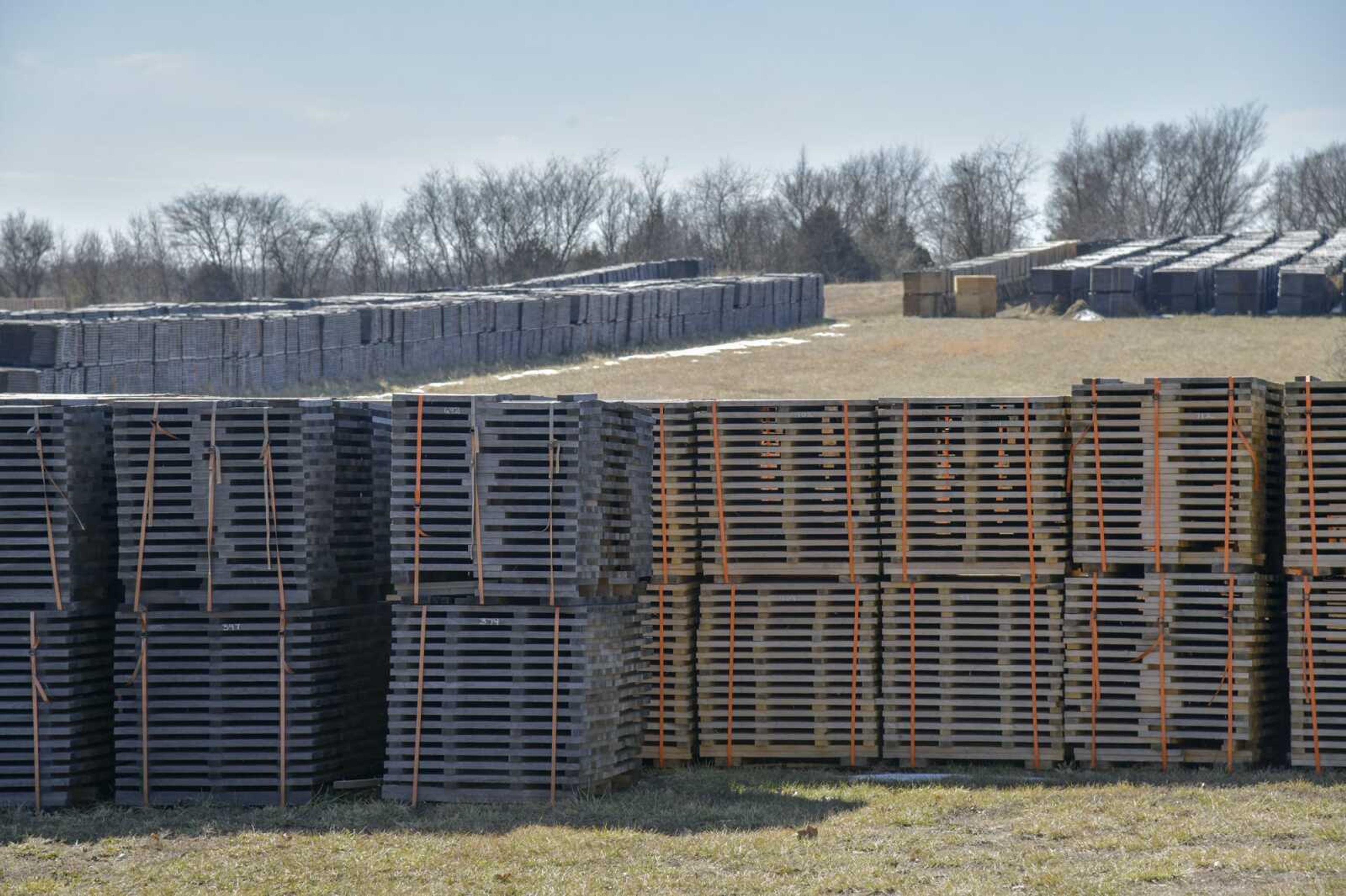 Stacks of ready stave orders sit Thursday on the property of Perryville Stave Co. in Perryville, Missouri.