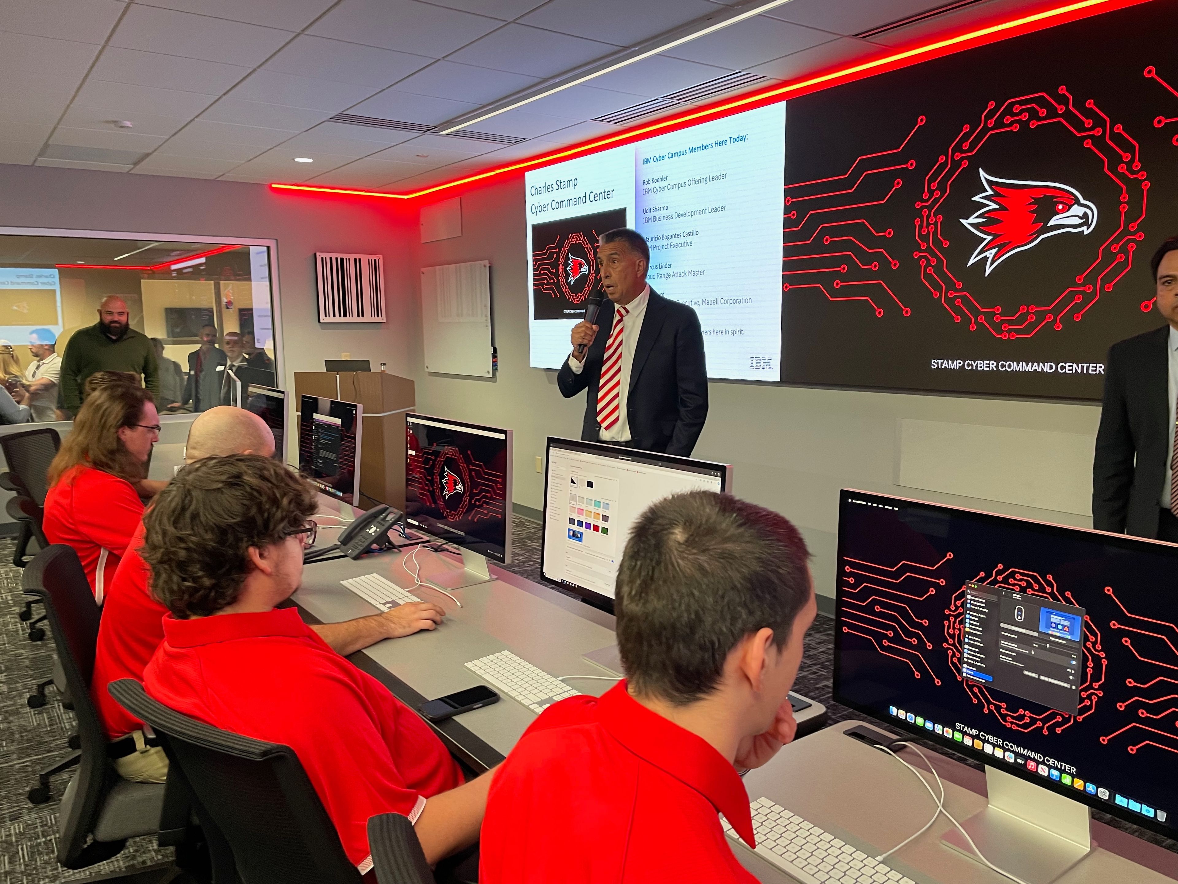 Dr. Mario Garcia talks about the Stamp Command Center, which features three types of cyber consoles, an “immersive” 27-foot display wall, an observation room and dedicated servers to allow students to engage in “realistic cyber breach scenarios, test their responses to enterprise-level threats and develop stronger security protocols.” In addition to training students, the command center will be utilized for cybersecurity competitions, as well as training sessions for local businesses to help them protect data.