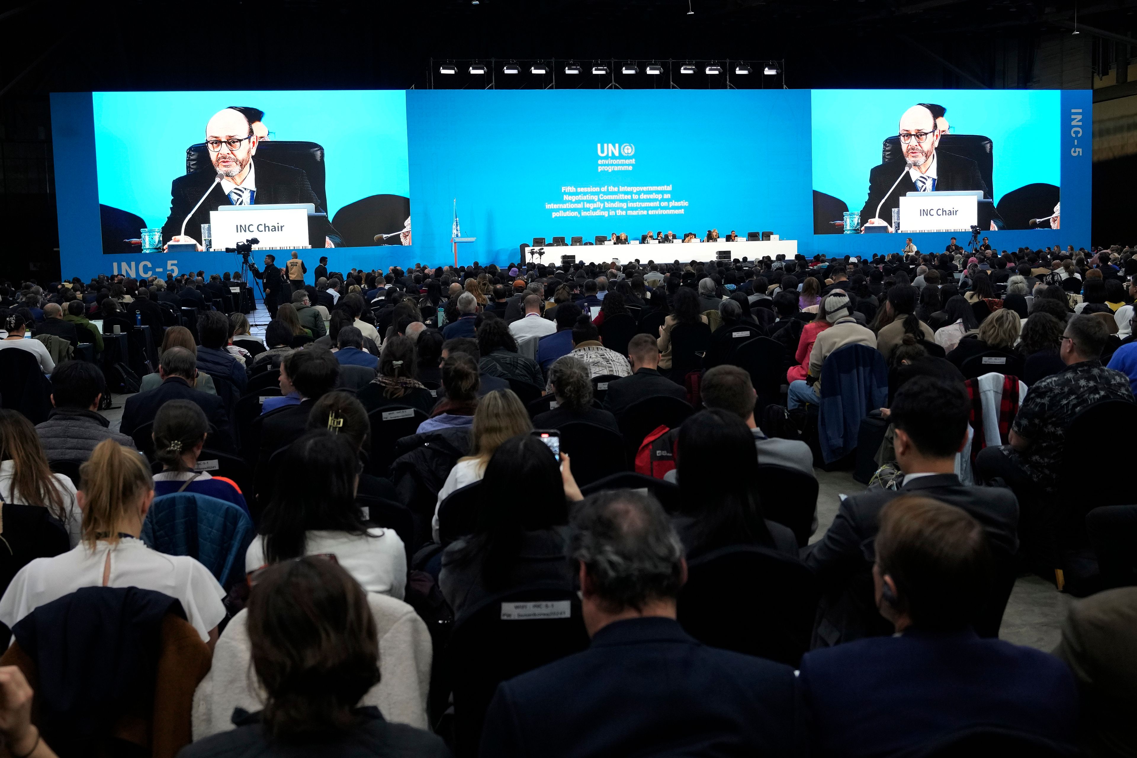 Chair of the International Negotiating Committee, Luis Vayas Valdivieso, on the screen, speaks during a plenary of the fifth session of the Intergovernmental Negotiating Committee on Plastic Pollution in Busan, South Korea, Sunday, Dec. 1, 2024. (AP Photo/Ahn Young-joon)