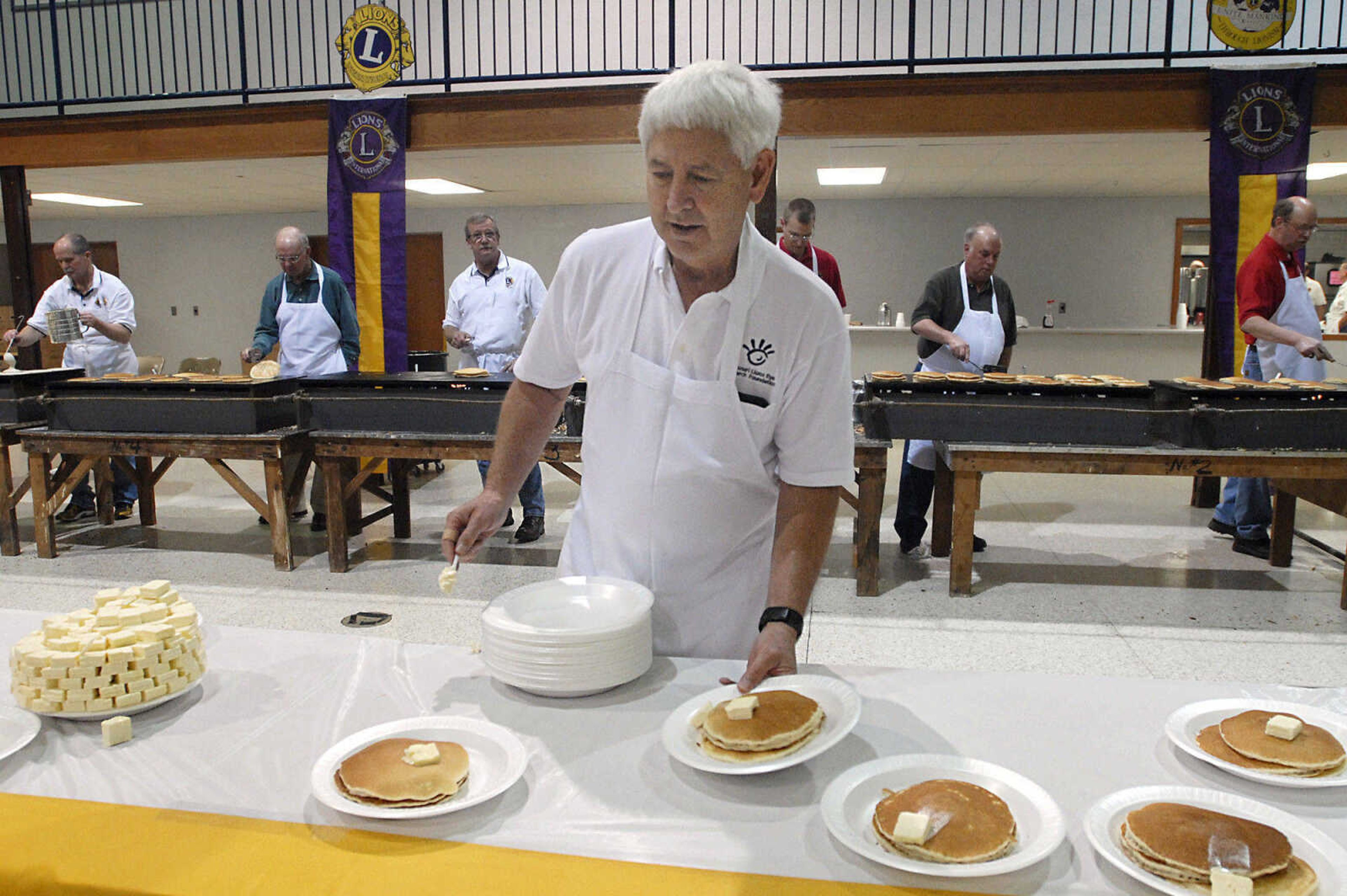 KRISTIN EBERTS ~ keberts@semissourian.com

Keith Deimund adds butter to the hot pancakes during the 73rd annual Pancake Day put on by the Cape Lions Club at the A.C. Brase Arena on Wednesday, March 23, 2011, in Cape Girardeau. More than 10,000 pancakes and 700 pounds of sausage were served.