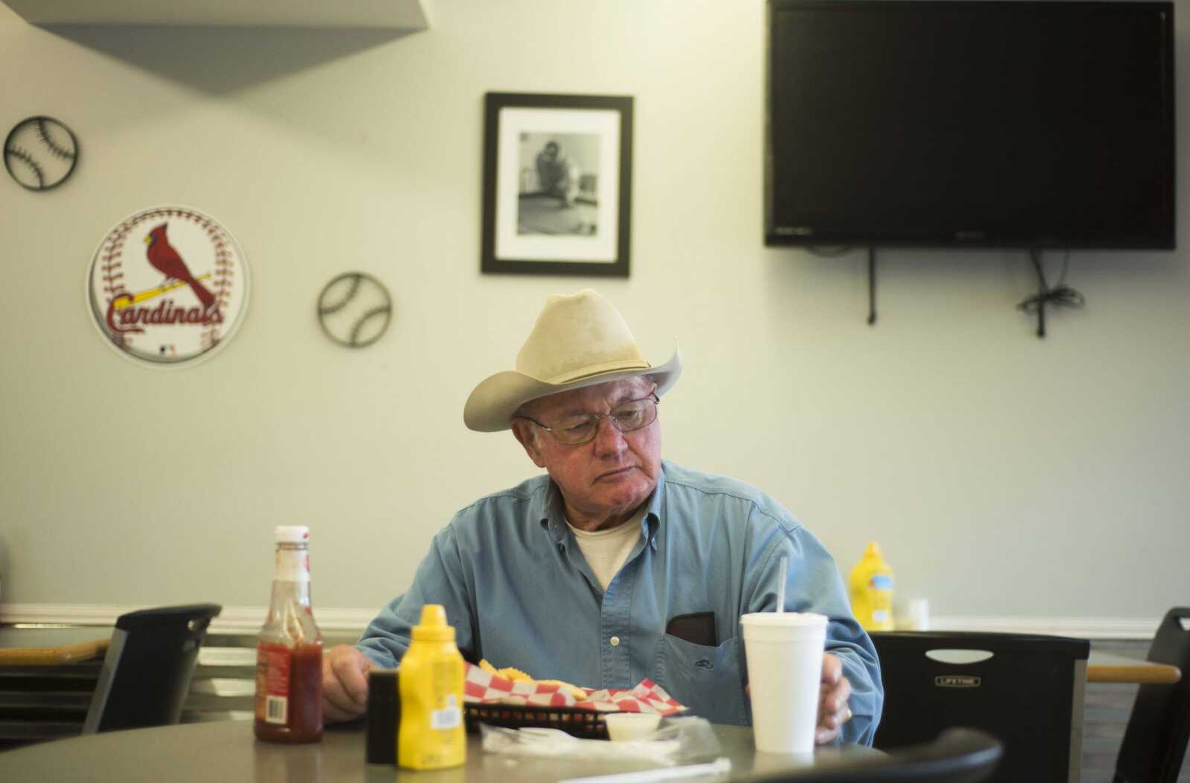 BEN MATTHEWS ~ bmatthews@semissourian.com Fred "Coach" Flook eats chicken nuggets Sept. 18, 2017 at Kenny's Flippin' Burgers in Chaffee.