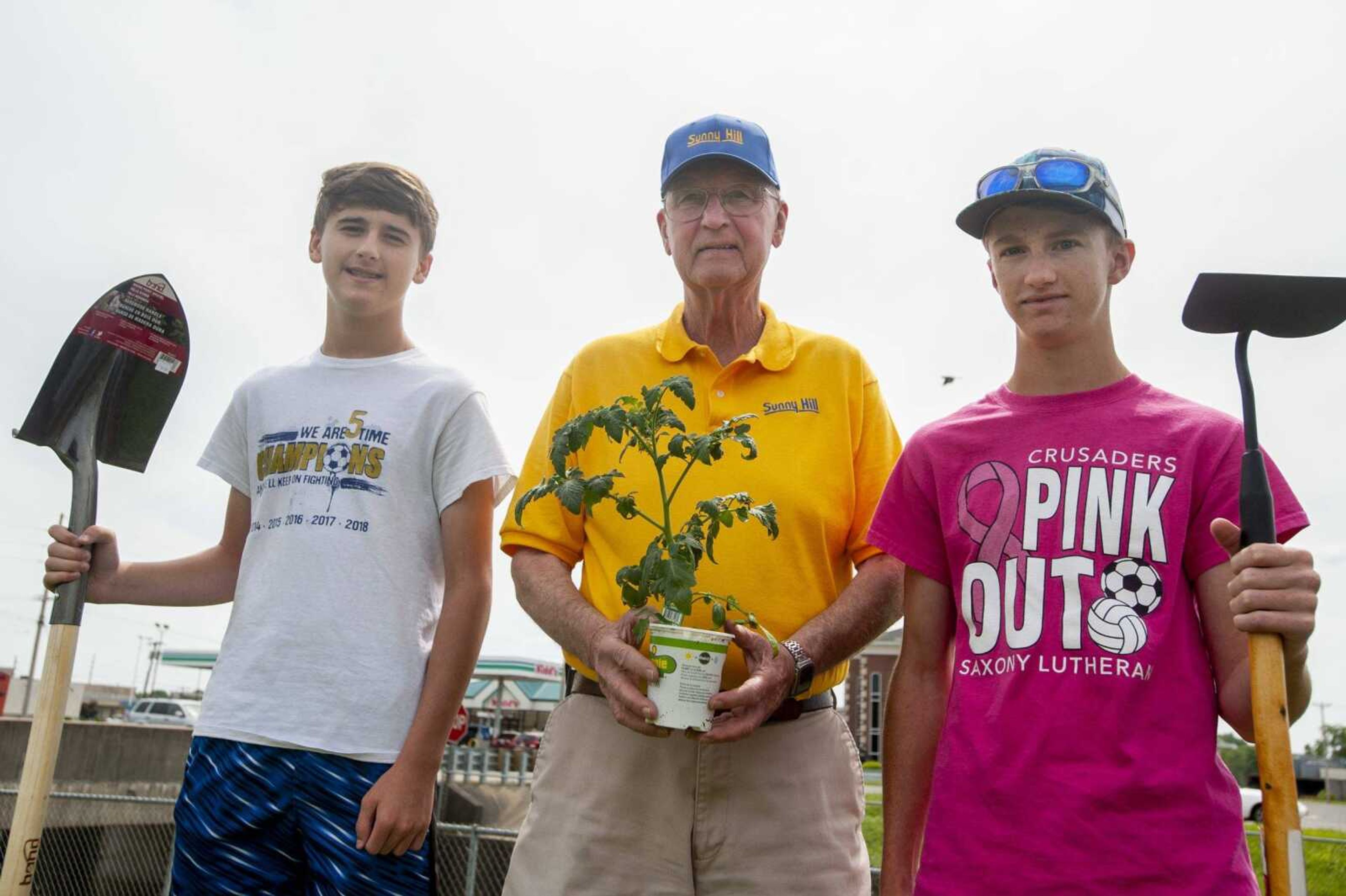 Kory Siebert, 14, left, and Coby Siebert, 18, pose for a photo with their grandfather Paul Schnare, all of Cape Girardeau, Tuesday in Cape Girardeau.